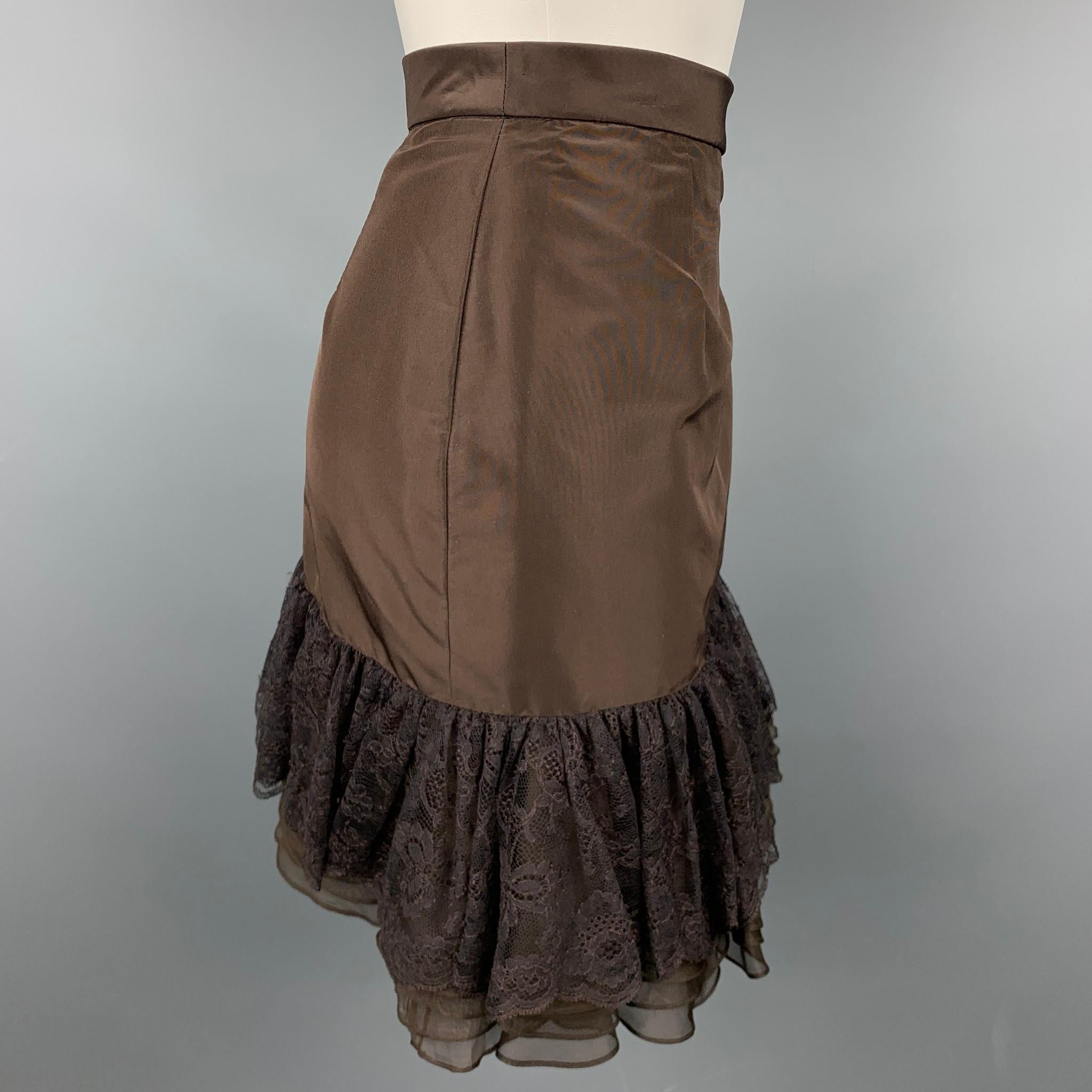 PETROU skirt comes in a chocolate brown silk with mixed materials featuring a petite waistband, clasp closure at side, lace ruffle, and a side zipper closure. 

Excellent Pre- Owned Condition.

Measurements:

Waist: 26 in.
Hips: 36 in.
Length: 19 in.