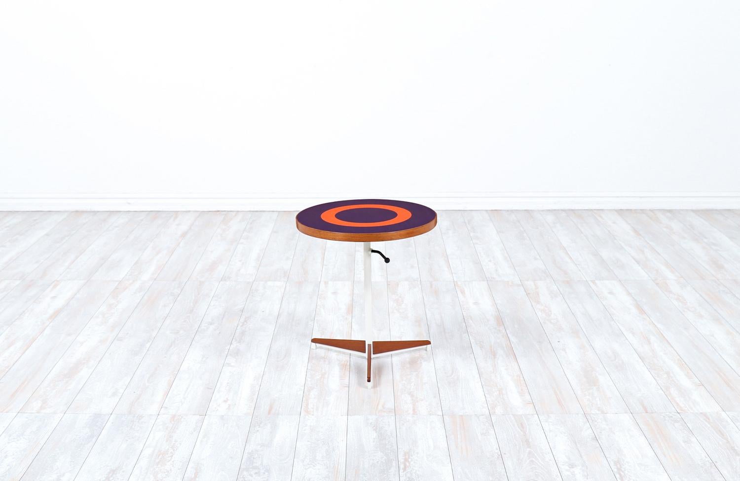 Petter Pepper Products adjustable tripod teak side table.