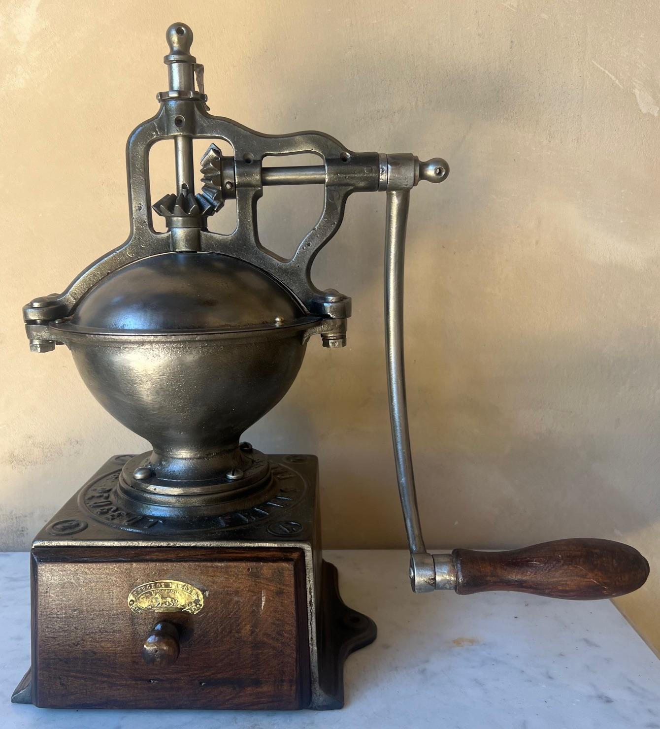 Modele A No 2 cast iron coffee grinder by Peugeot Freres, made in France in the latter part of the 19th century.
The grinder is in good working order.  

The durability of Peugeot grinders is due to the high quality steel used to make them.  The