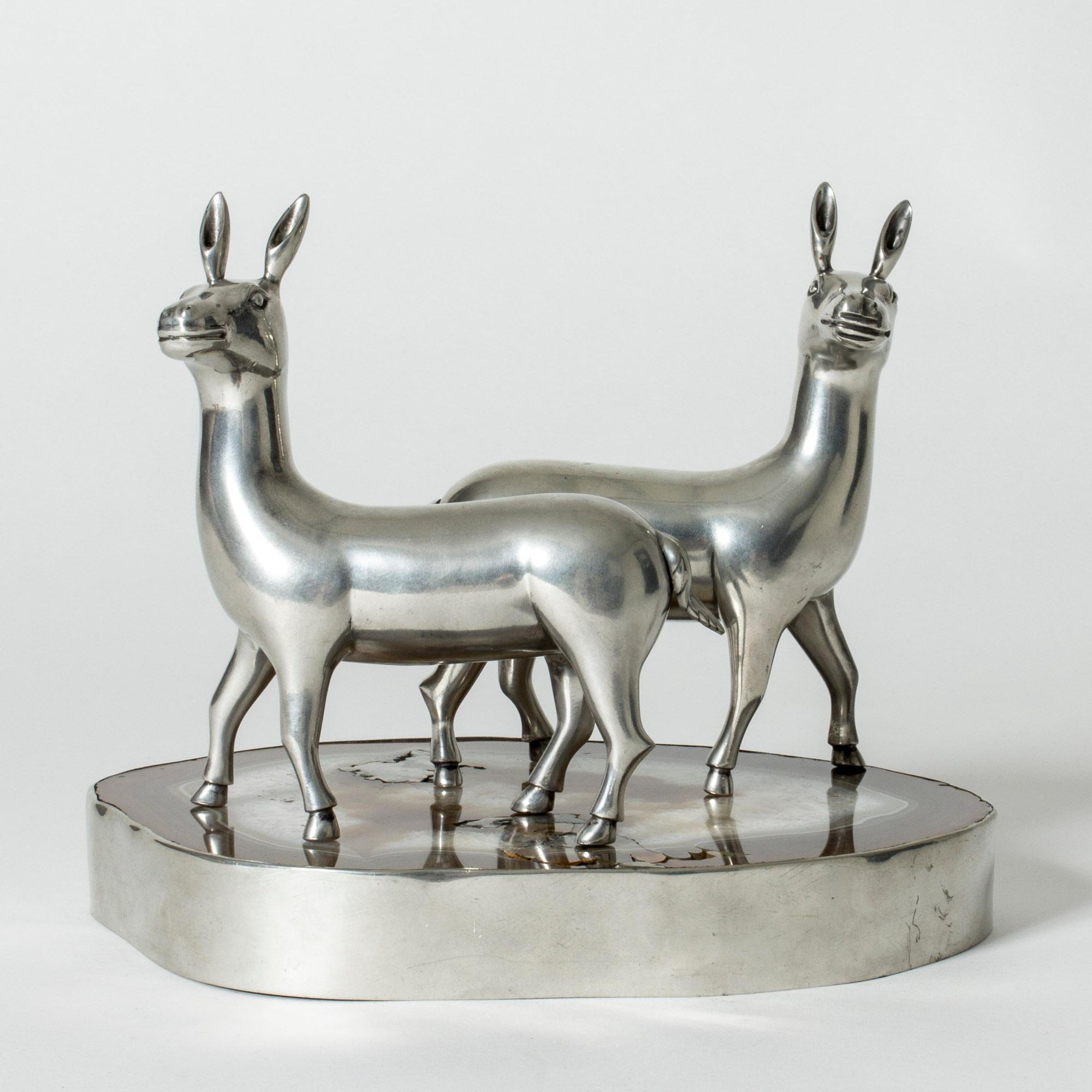 Amazing table center piece by Estrid Ericson, made from pewter and an agate slice encircled with by a pewter rim. Two lovely lama figurines stand on top of the agate tray. A whimsical and beautiful composition.