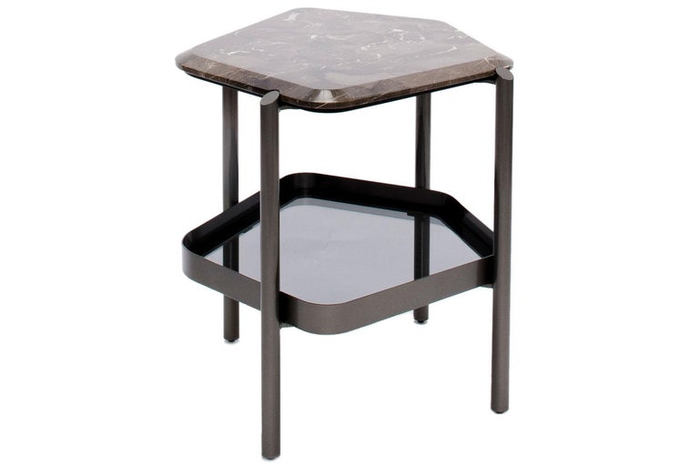 Skyline side table by Giorgetti

Skyline is a series of tables with customizable shapes and finishes from Giorgetti. Our side table on display is a pentagonal shaped low table with a metal frame finished in pewter. The overall shape of this piece