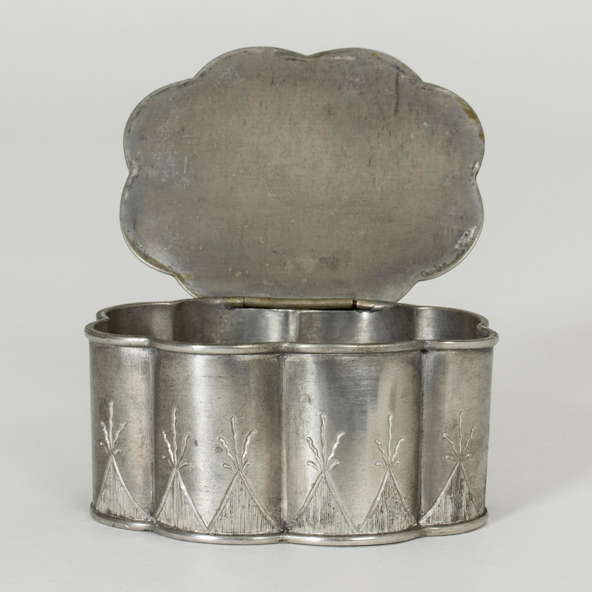 Lovely pewter box from Herman Bergman, in oval shape with a scalloped silhouette. Pretty etched pattern on the lid and around the base.