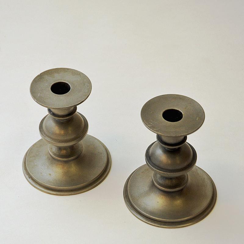 A great vintage pair of pewter candle holders by Edvin Ollers for Schreuder & Olsson - Sweden 1947. Lovely Swedish Modern candle holder set with decorative sculpted body shape. Very good vintage condition and nice patina. Signed: Gjutet Tenn, Ollers
