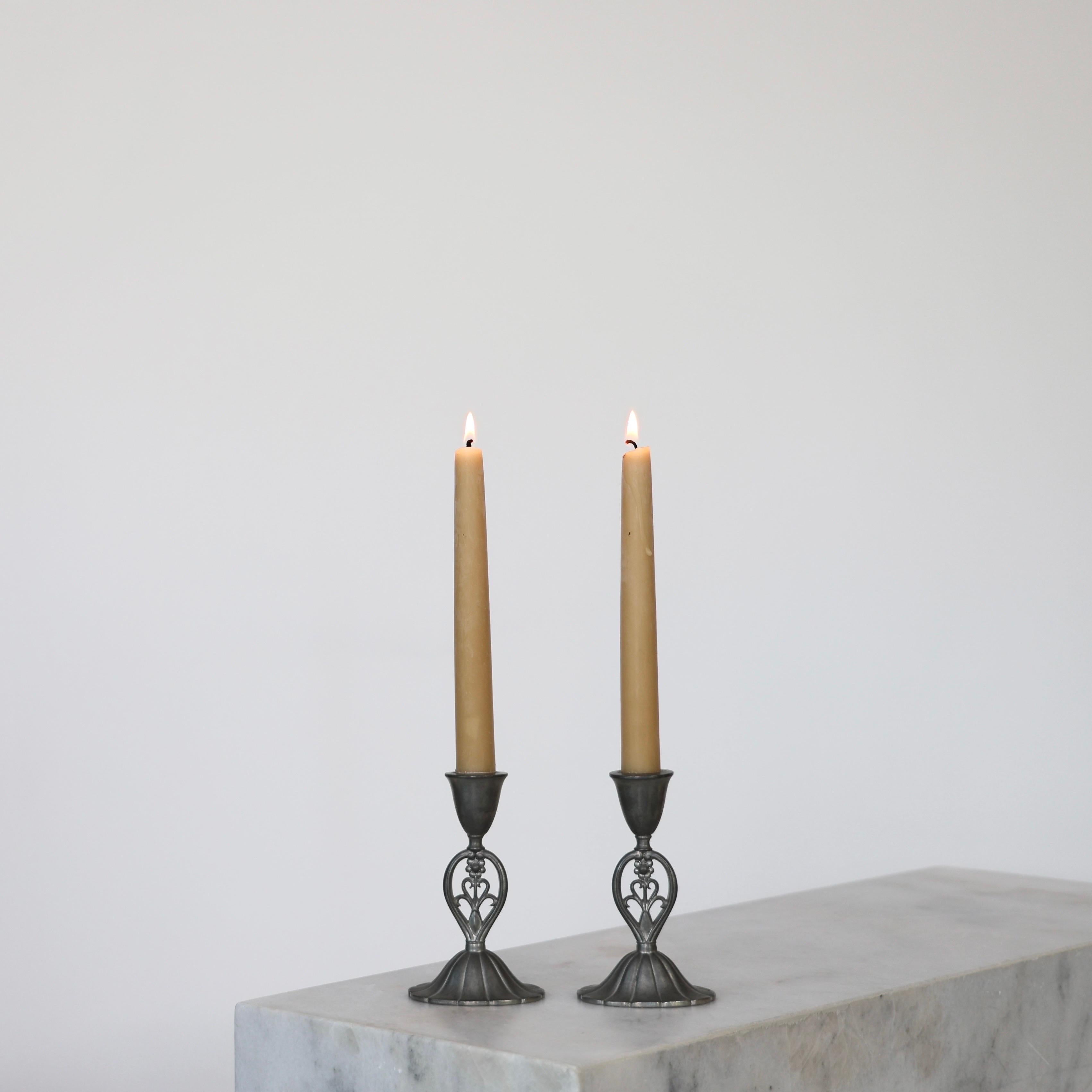 Set of early-work Candle Holders designed by Just Andersen in 1920s. A fine set for a beautiful place. 

* Pair (2) of Pewter Candlestick Holders
* Designer: Just Andersen
* Manufacturer: Just Andersen
* Style: 602
* Year: 1918-1926
* Condition: