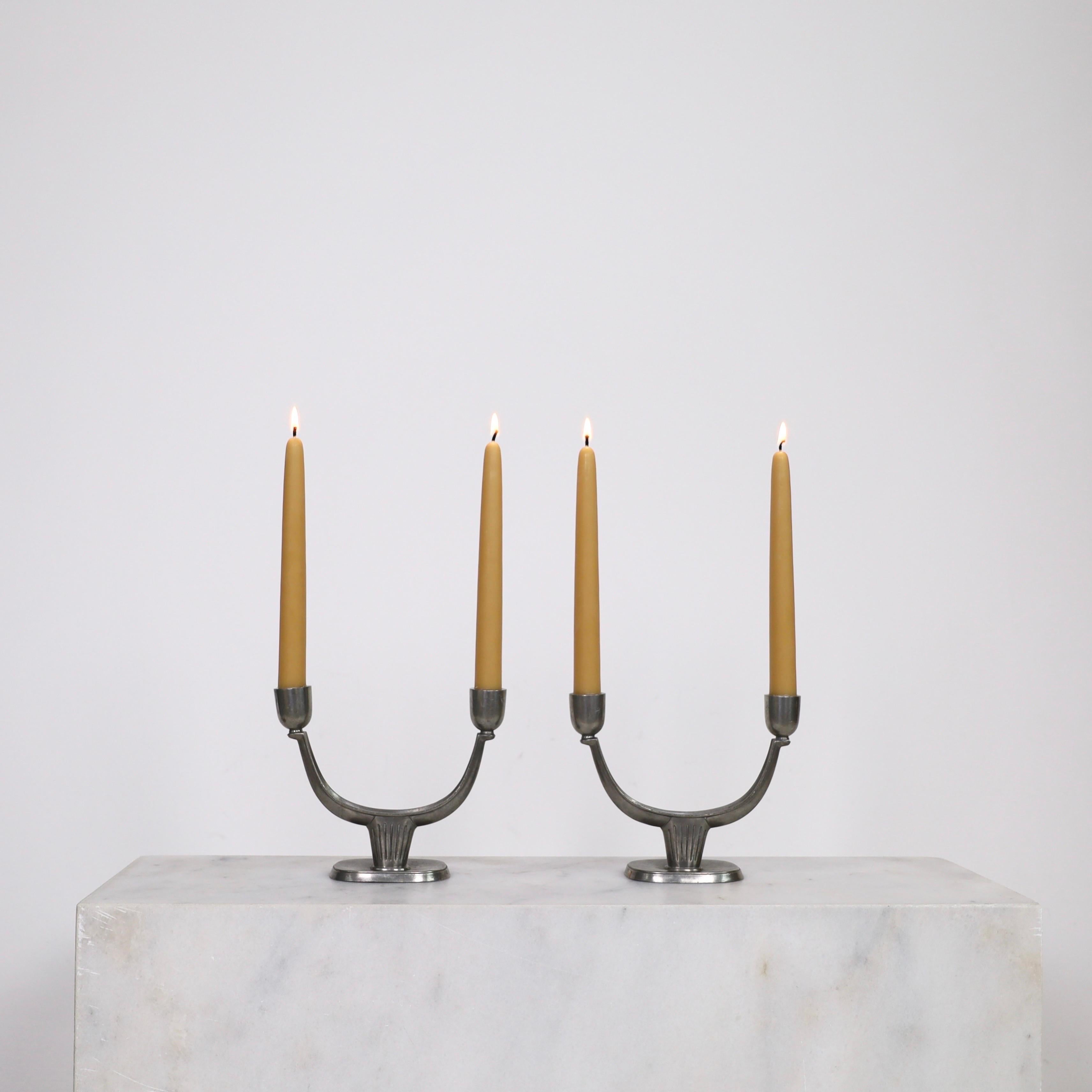 Set of Pewter Candle Holders made by Just Andersen in 1950s. A fine set for a beautiful table. 

* Pair of Pewter Candlestick Holders fit for two candles 
* Manufacturer: Just Andersen
* Style: 2581
* Year: 1956
* Condition: Good vintage condition.