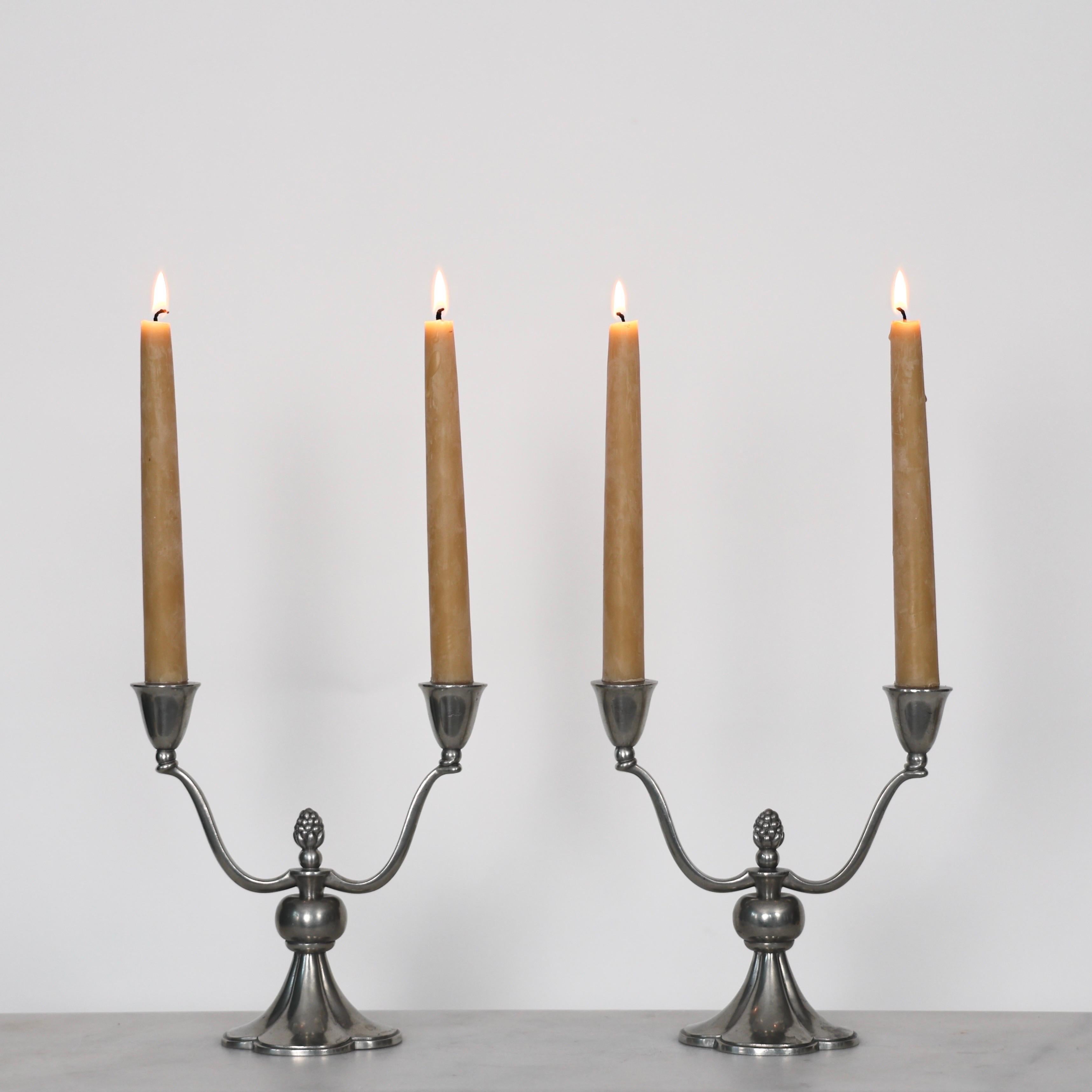Set of Pewter Candlestick Holders made by Just Andersen in the 1920s. An elegant set for a beautiful table. 

* Pair of Pewter Candlestick Holders fit for two candles 
* Designer: Just Andersen
* Manufacturer: Just Andersen
* Style: 769
* Year: