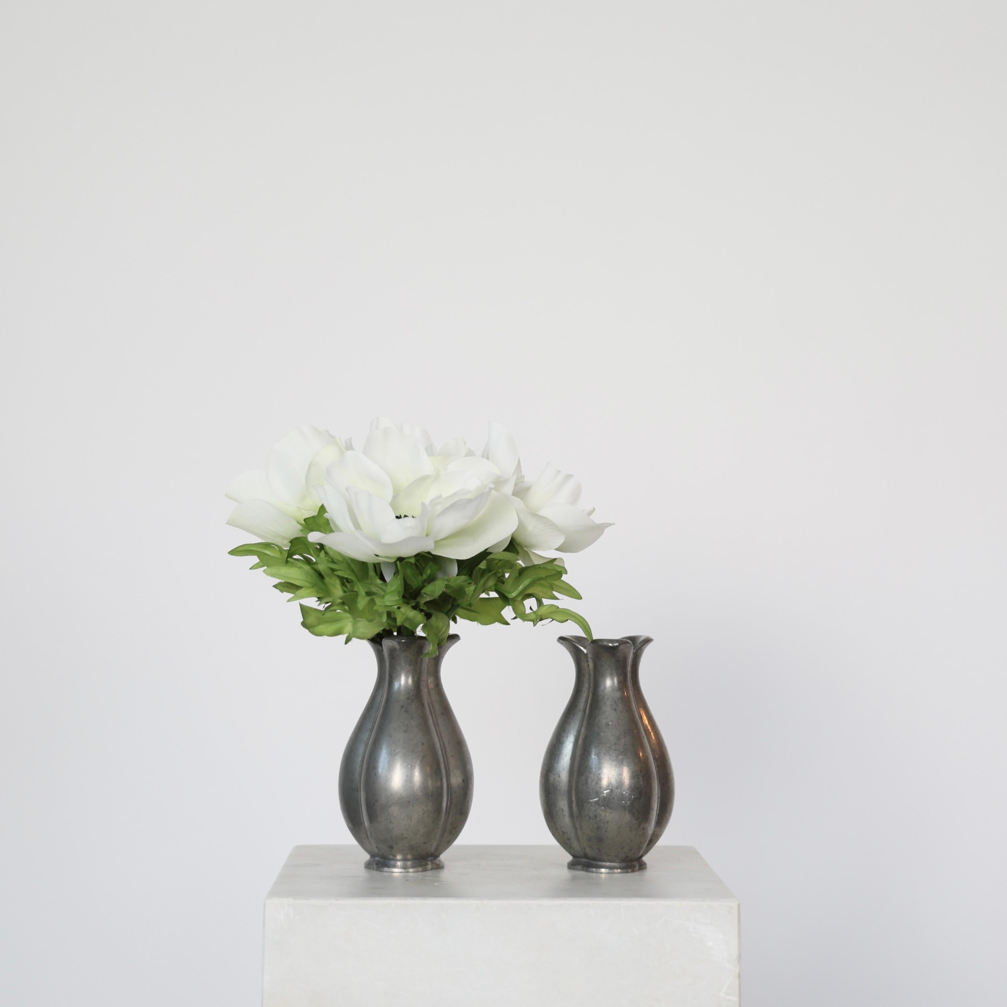 Set of Elegant Pewter Flower Vases designed by Ellen Schlanbusch for Just Andersen in the late 1940s. 

* Set (2) of flower-shaped pewter vases 
* Designer: Ellen Schlanbusch 
* Manufacturer: Just Andersen
* Style: 2480
* Year: 1949-1950
*