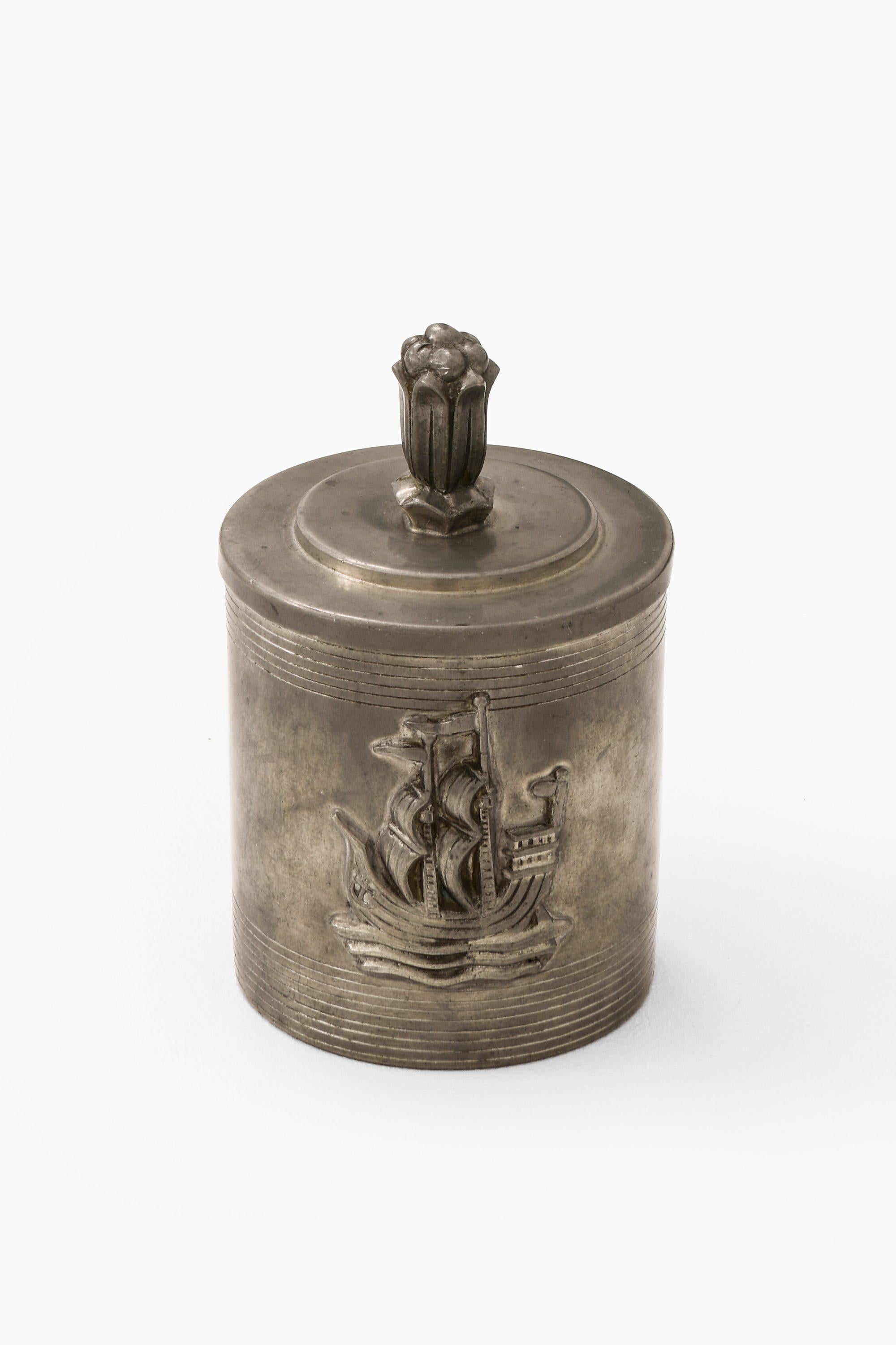 Pewter Jar Attributed to Sylvia Stave, 1940

Additional Information:
Material: Pewter
Produced by C.G. Hallberg in Sweden
Dimensions (W x D x H): 9.5 x 9.5 x 14 cm