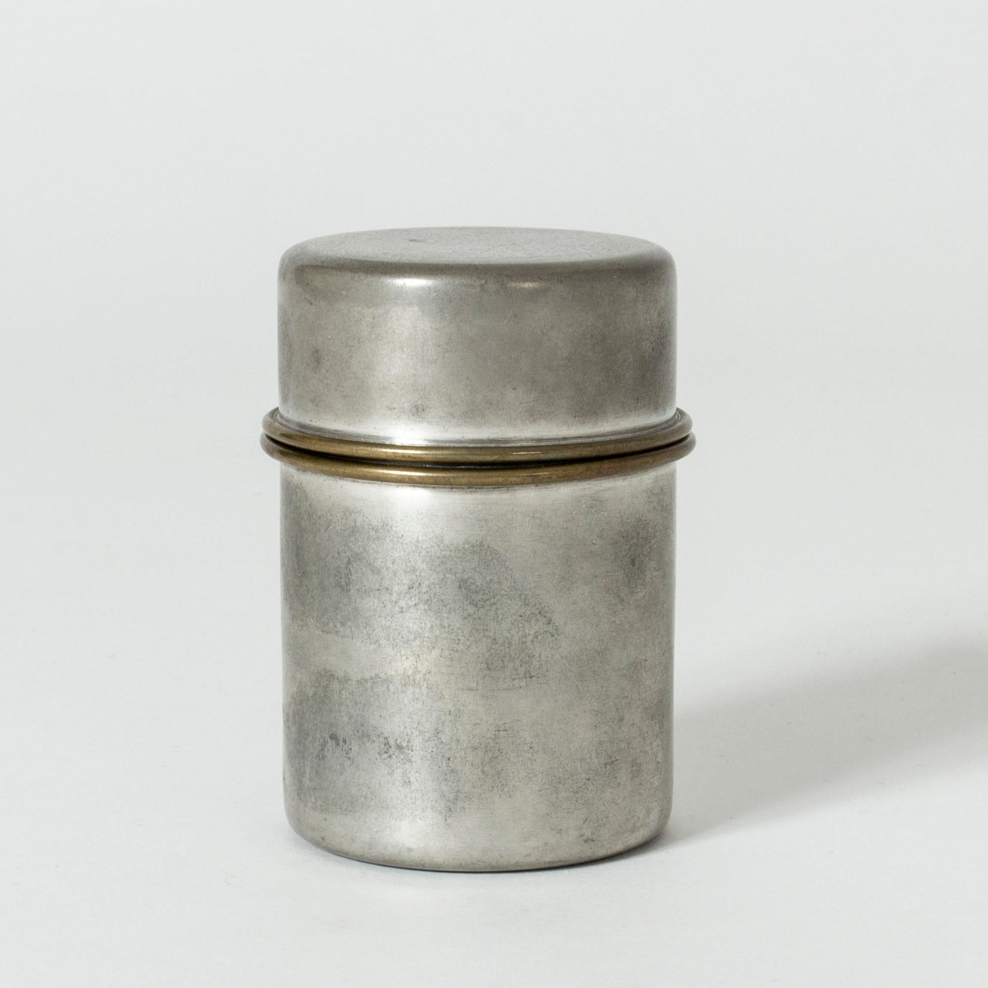 Lovely, sleek pewter jar by Björn Trädgårdh. Perfectly subtle brass rim on the lid.