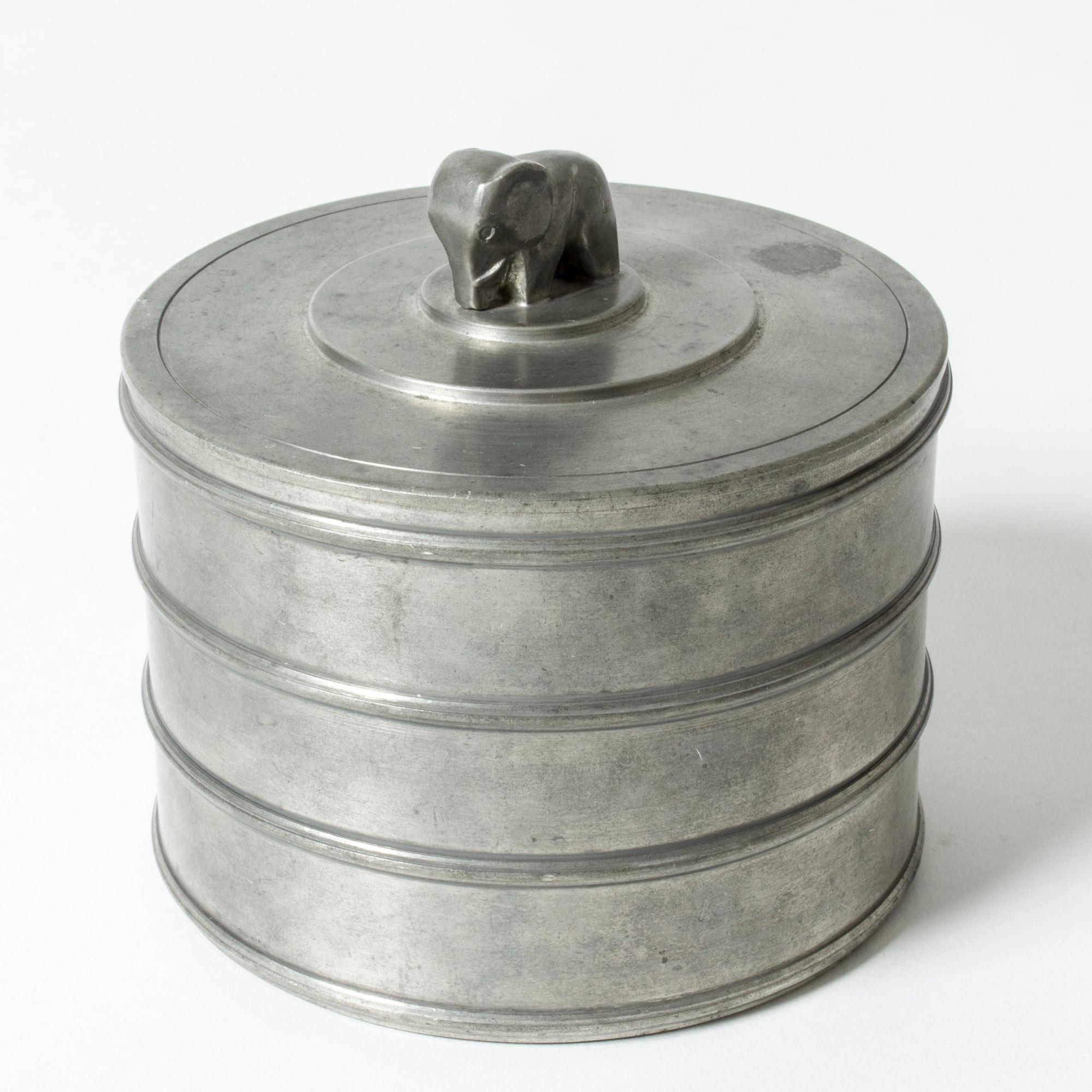 Pewter jar by Sylvia Stave, in a strict simplistic design, contrasted with an adorable elephant on the lid.

Sylvia Stave was a fascinating representative of Swedish mid-century design with her immaculate, sober designs that lead her to become