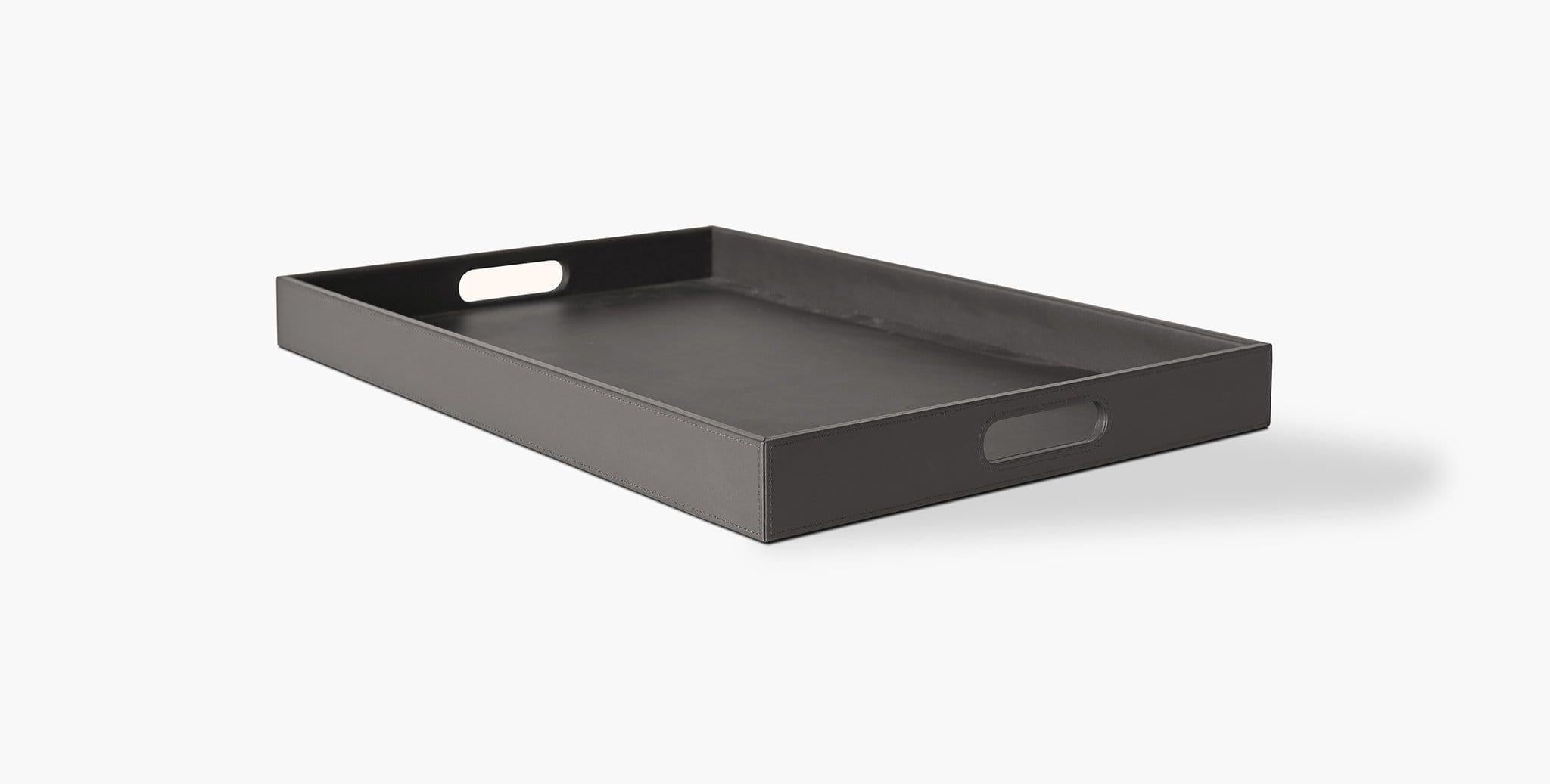 Our Lago Tray has side cutouts for easy handling, perfect for curating a beautiful coffee table vignette. Our handcrafted leathers and finishes are inspired by the natural variations within fibers, textures, and weaves. Each selection is