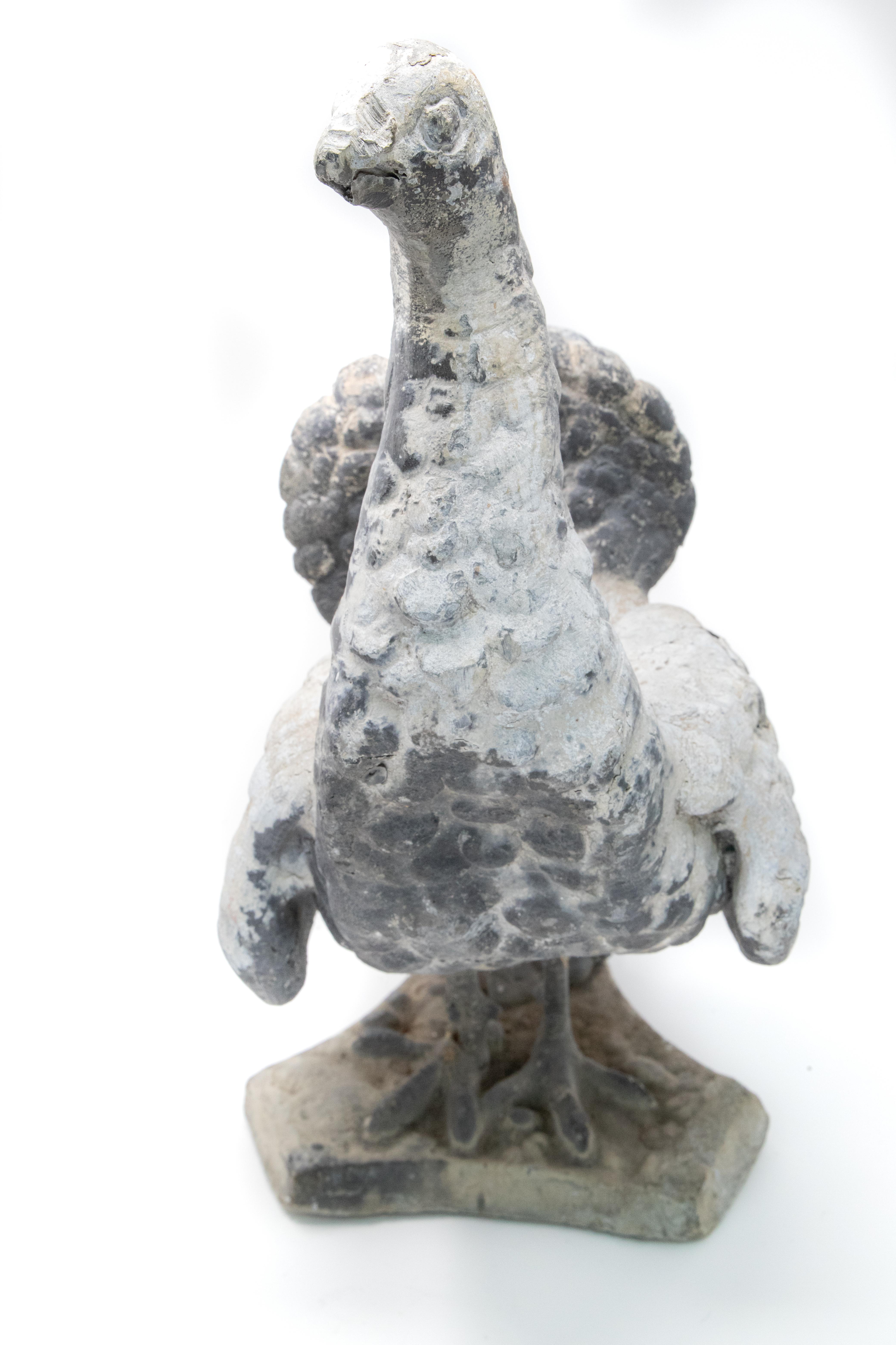 Offering this gorgeous cast Pewter garden statue. Starting on a 3 point base the feet and base of tail start the statue. Rising up to the body of the peacock with the beautiful feathers. The fan is a separate piece that sits in Peacocks tail. Note