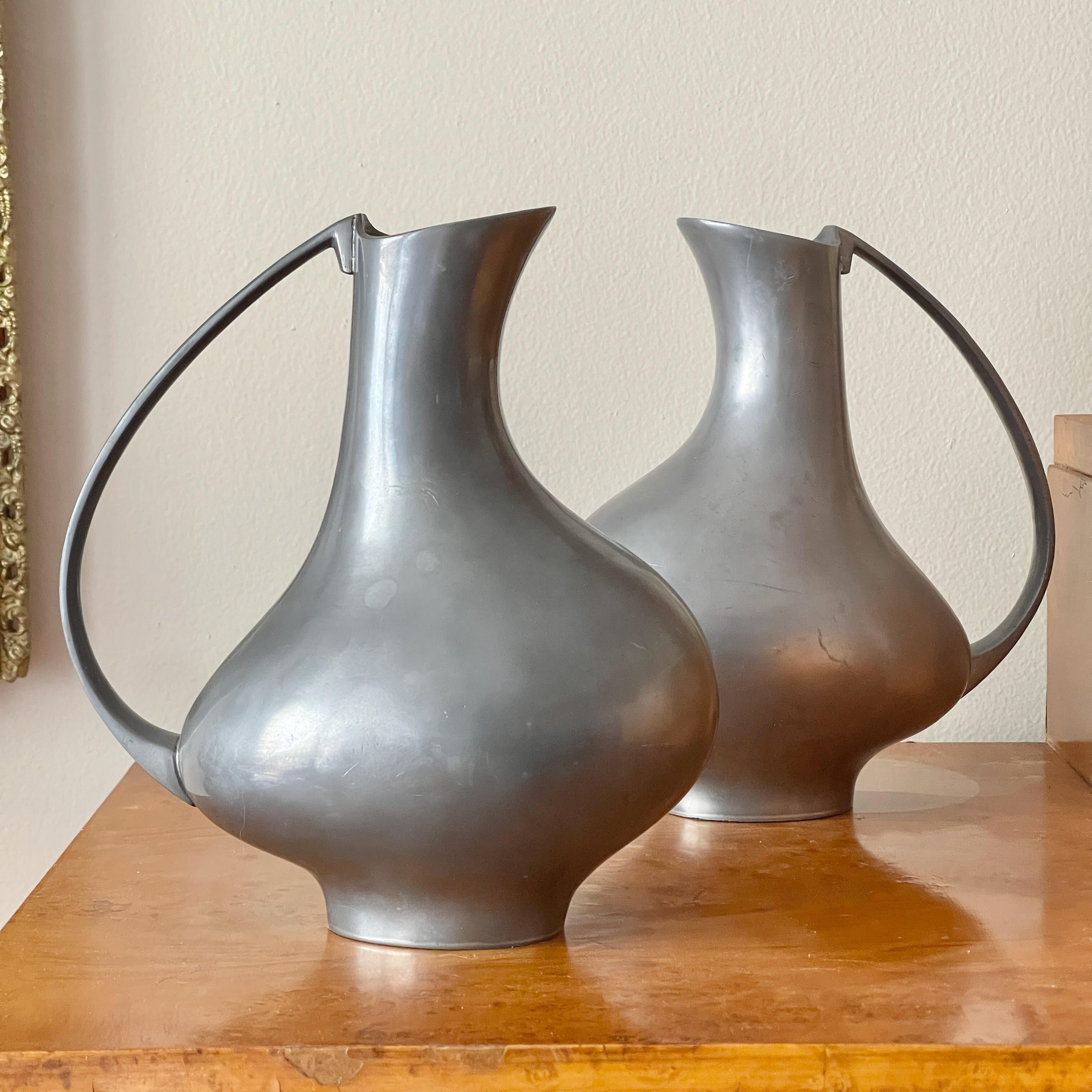 Sculptural mid-century pewter handled pitcher in the style of the 