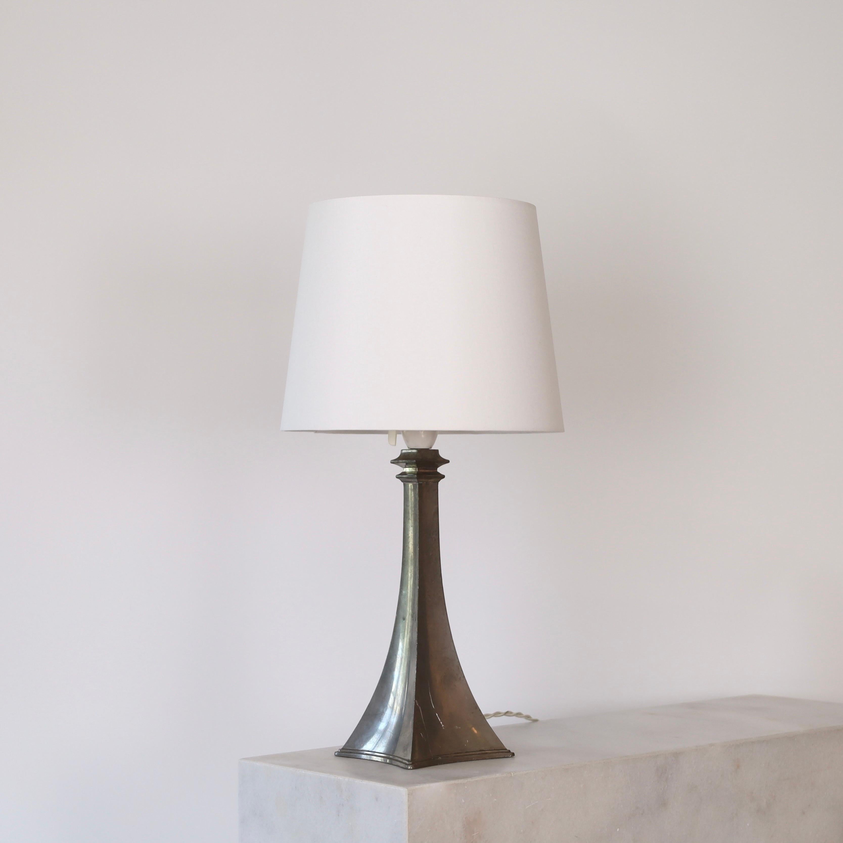 Rare Pewter table lamp manufactured by Just Andersen in the early 1950s. A timeless piece for a beautiful home.

* Pewter table lamp with a white fabric shade
* Manufacturer: Just Andersen
* Style: 2610
* Year: 1950s
* Condition: Good vintage