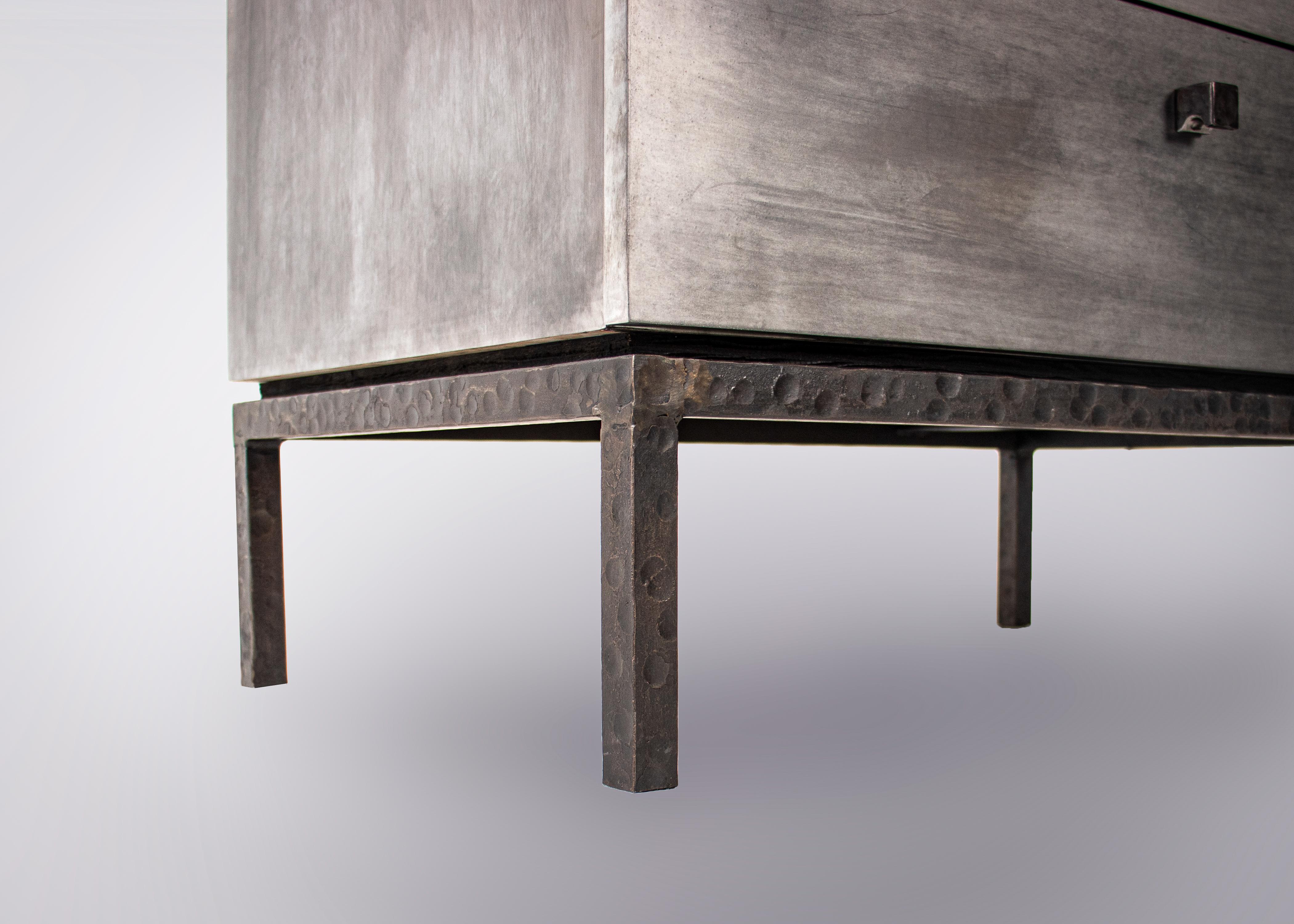 Custom pewter zinc three-drawer bedside table with white oak top on hamemered steel base.