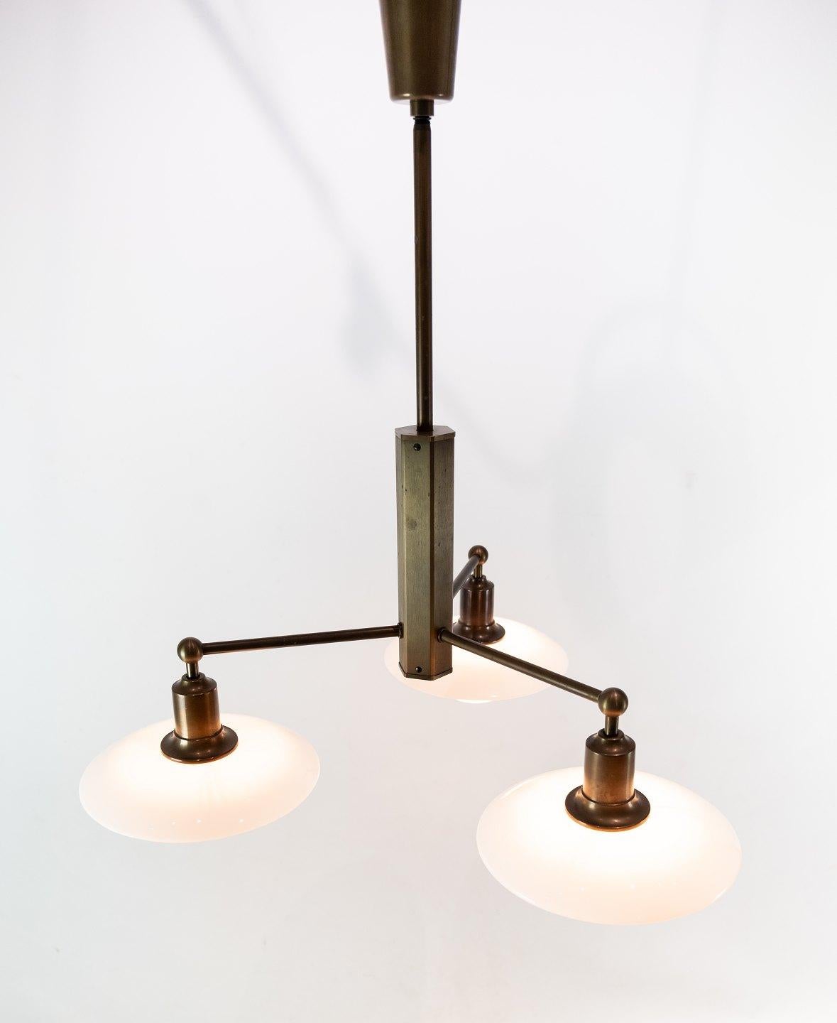 PH 2/1 stem fitting designed by Poul Henningsen and manufactured by Louis Poulsen. The stem is in burnished brass. The lamp was made in 1997 to celebrate the 100th year anniversary of Poul Henningsen.
   