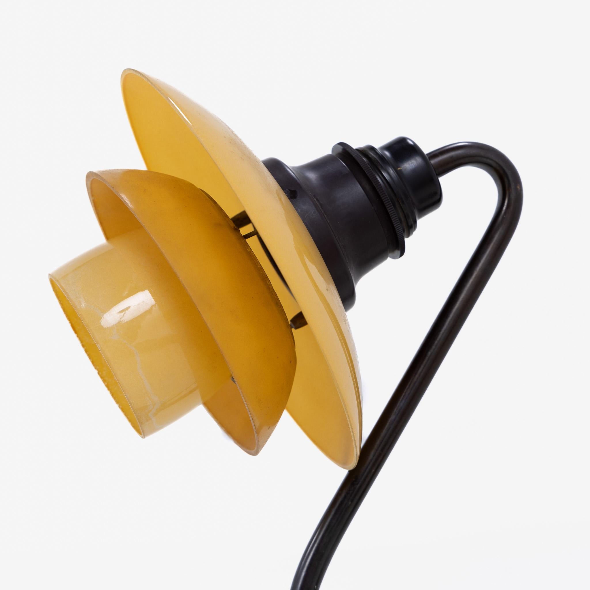 PH 2/2 - ‘Snowdrop’ table lamp in burnished brass with frosted yellow glass shades. Labelled ‘Patented’.