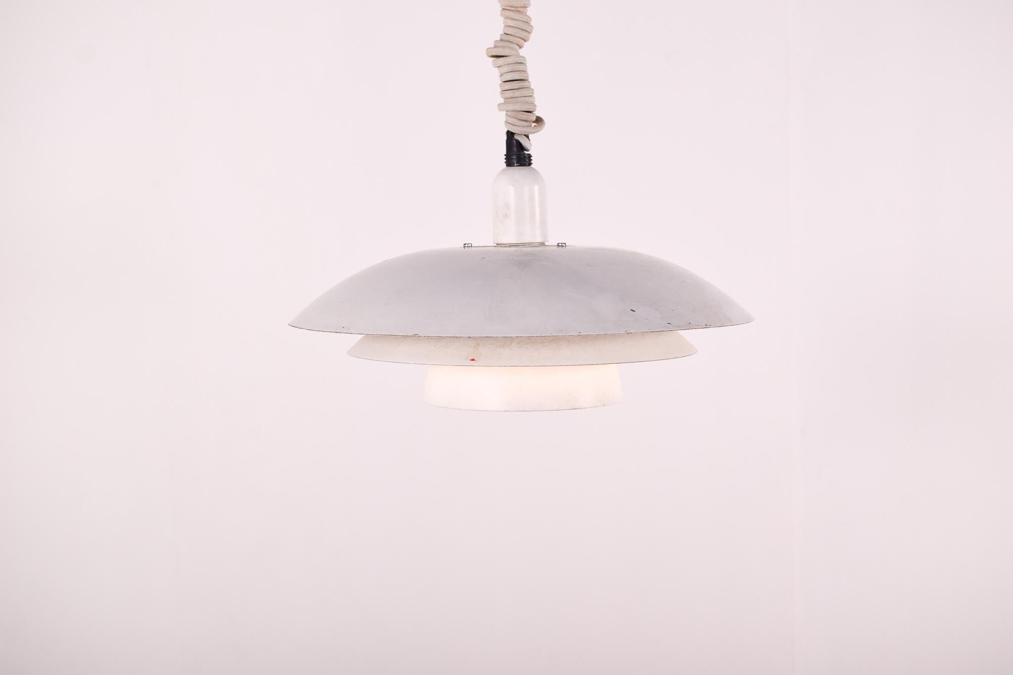 Designed by Poul Henningsen for Louis Poulsen, PH 4/3 Pendant is based on the principle of a reflective system, which directs the majority of the light downwards. The shades are made of metal and painted white to ensure uniform, comfortable light