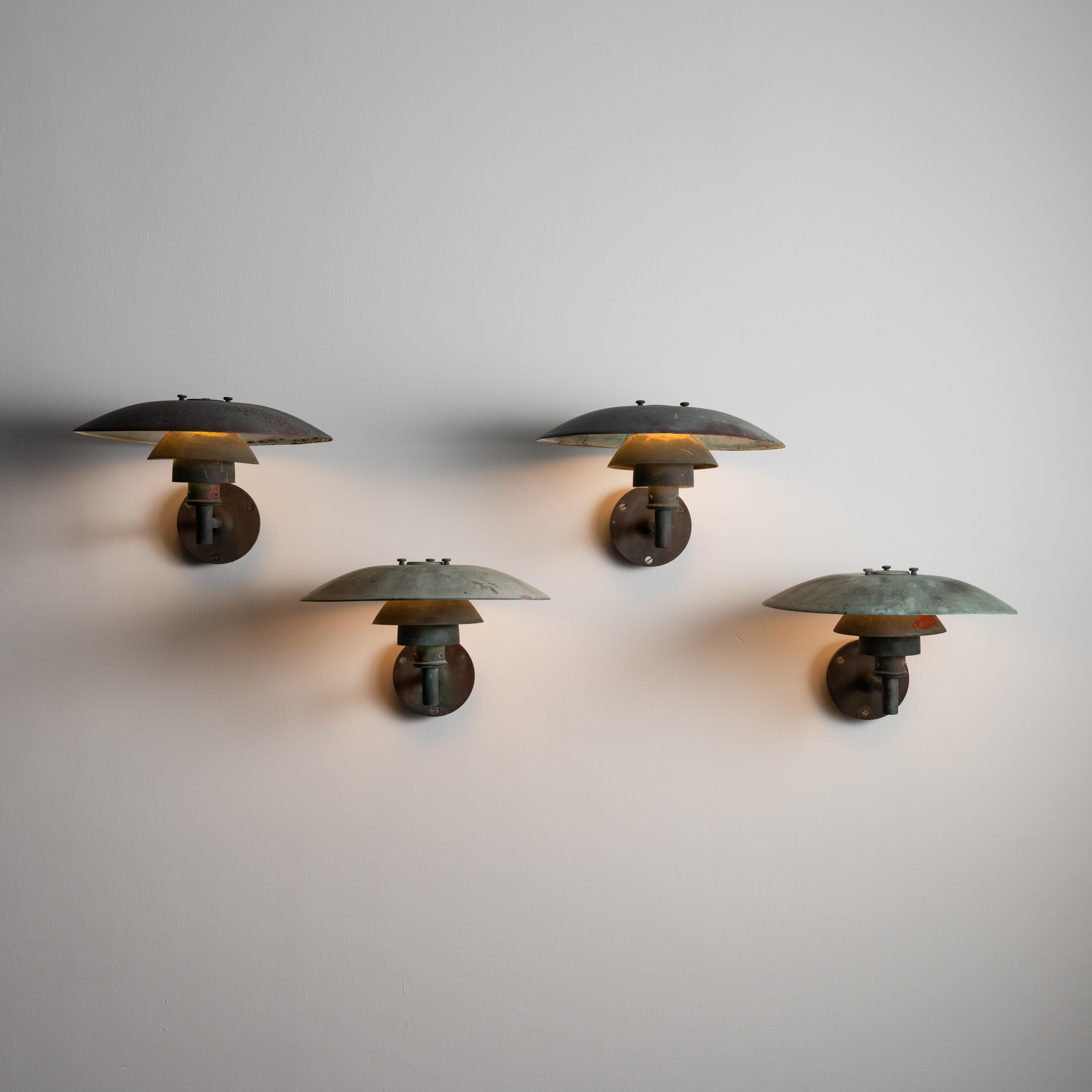Ph 4/3 wall sconces by Poul Henningsen for Louis Poulsen. Designed and manufactured in Denmark, circa the 1960s. All copper sconces true to Henningsen's original tiered designs for Louis Poulsen. Beautifully aged fixtures meant for indoor or outdoor