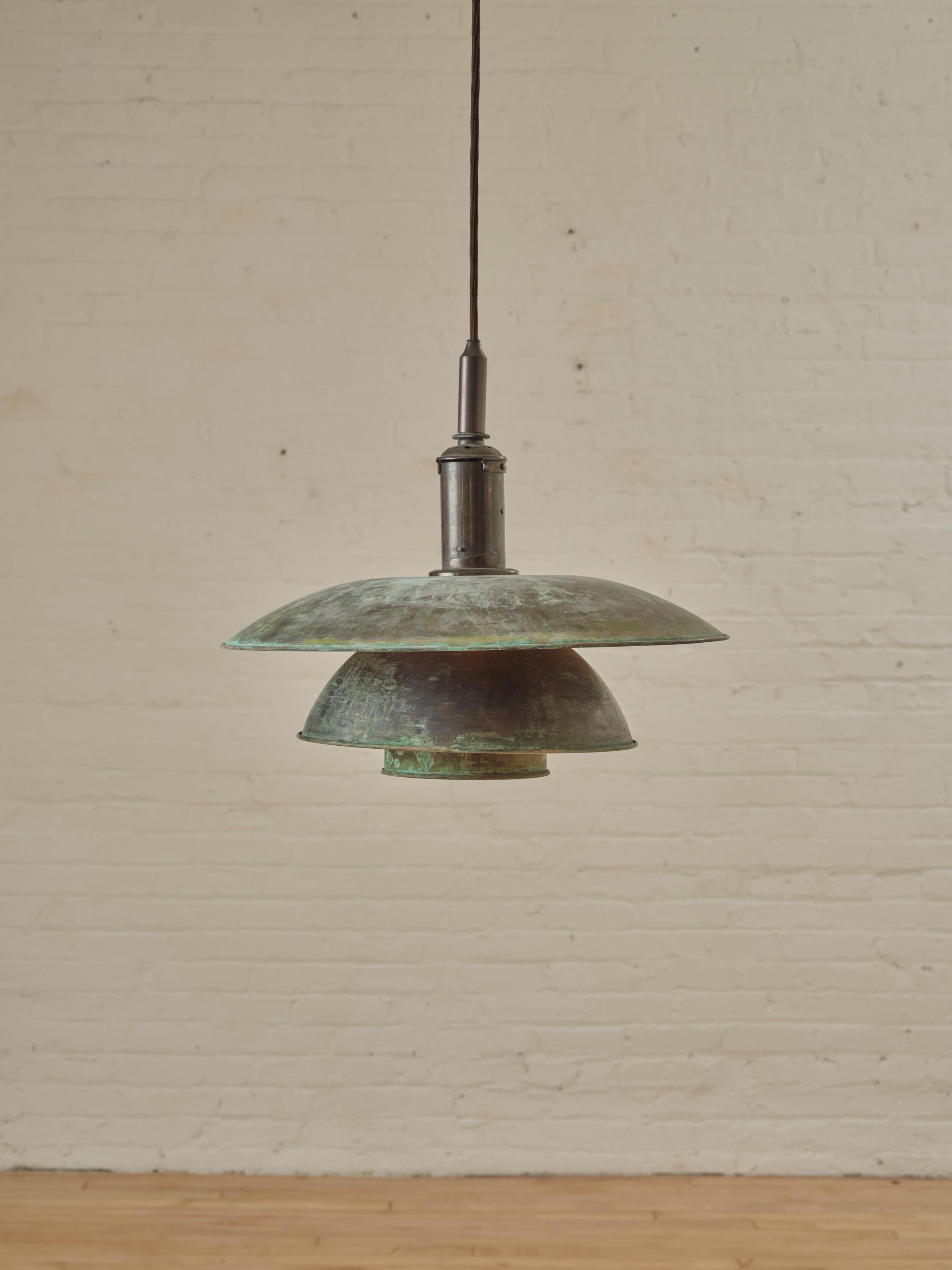 PH 4/4 Ceiling Pendant by Poul Henningsen for Louis Poulsen in patinated copper. The pendant can be rewired to fit ceiling height. 

Dimensions: 25.59