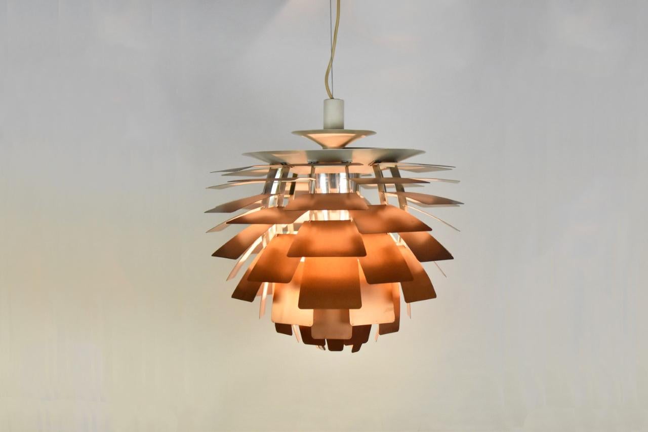 First edition PH Artichoke pendant by Poul Henningsen for Louis Poulsen, Denmark, 1950s. This iconic pendant is constructed from copper, enameled steel, chrome plated brass and enameled aluminium. It is designed in 1958 for Langelinie Pavillionen in