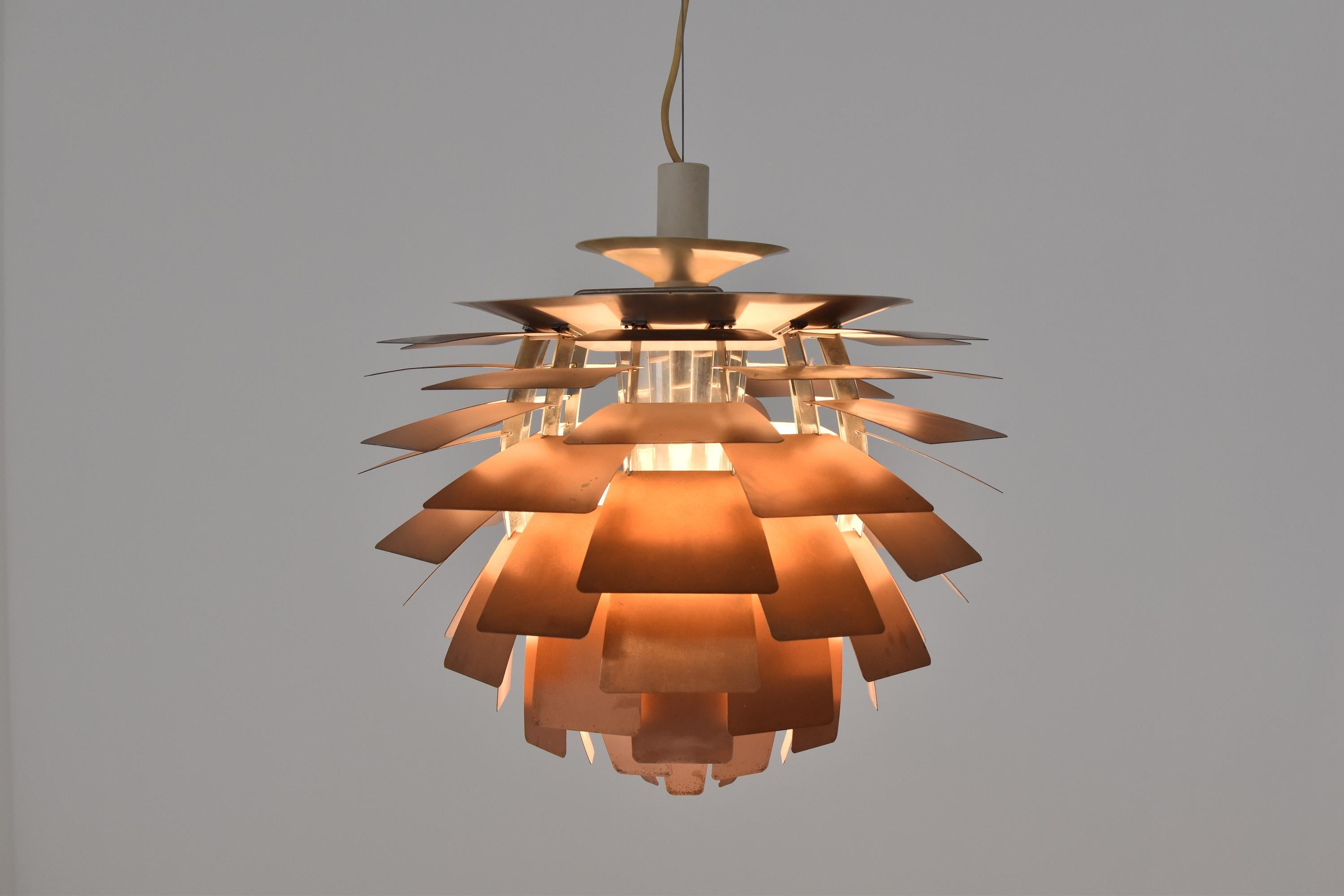 First edition PH Artichoke pendant by Poul Henningsen for Louis Poulsen, Denmark, 1950s. This iconic pendant is constructed from copper, enameled steel, chrome plated brass and enameled aluminium. It is designed in 1958 for Langelinie Pavillionen in