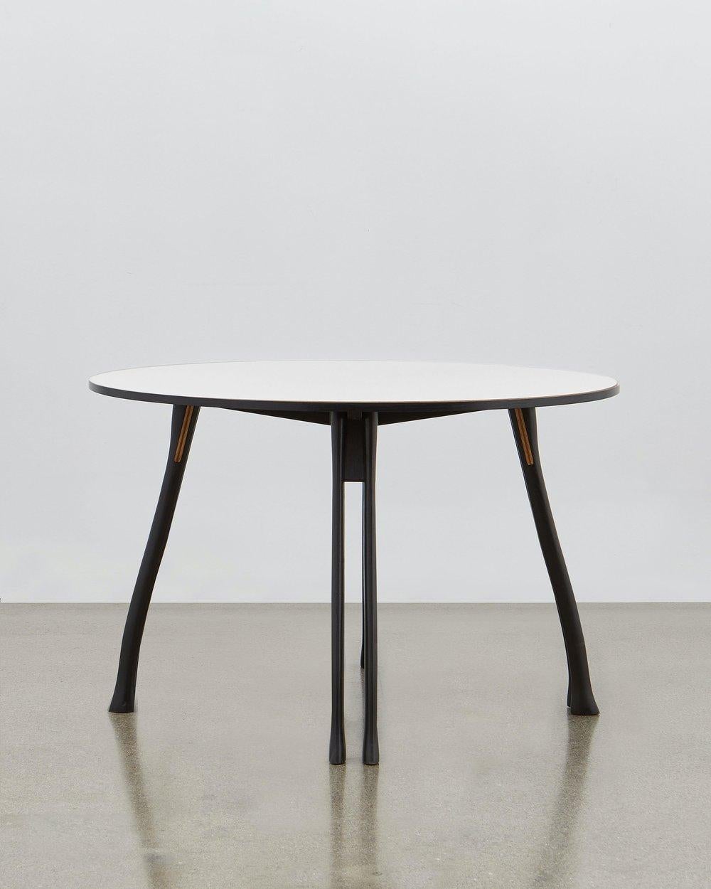Inspired by the humble axe handle, Poul Henningsen has utilized this familiar and tactile shape to provide the basis for the legs of the versatile table.

This piece of furniture stays true to the fundamental values that drove its designer: it is