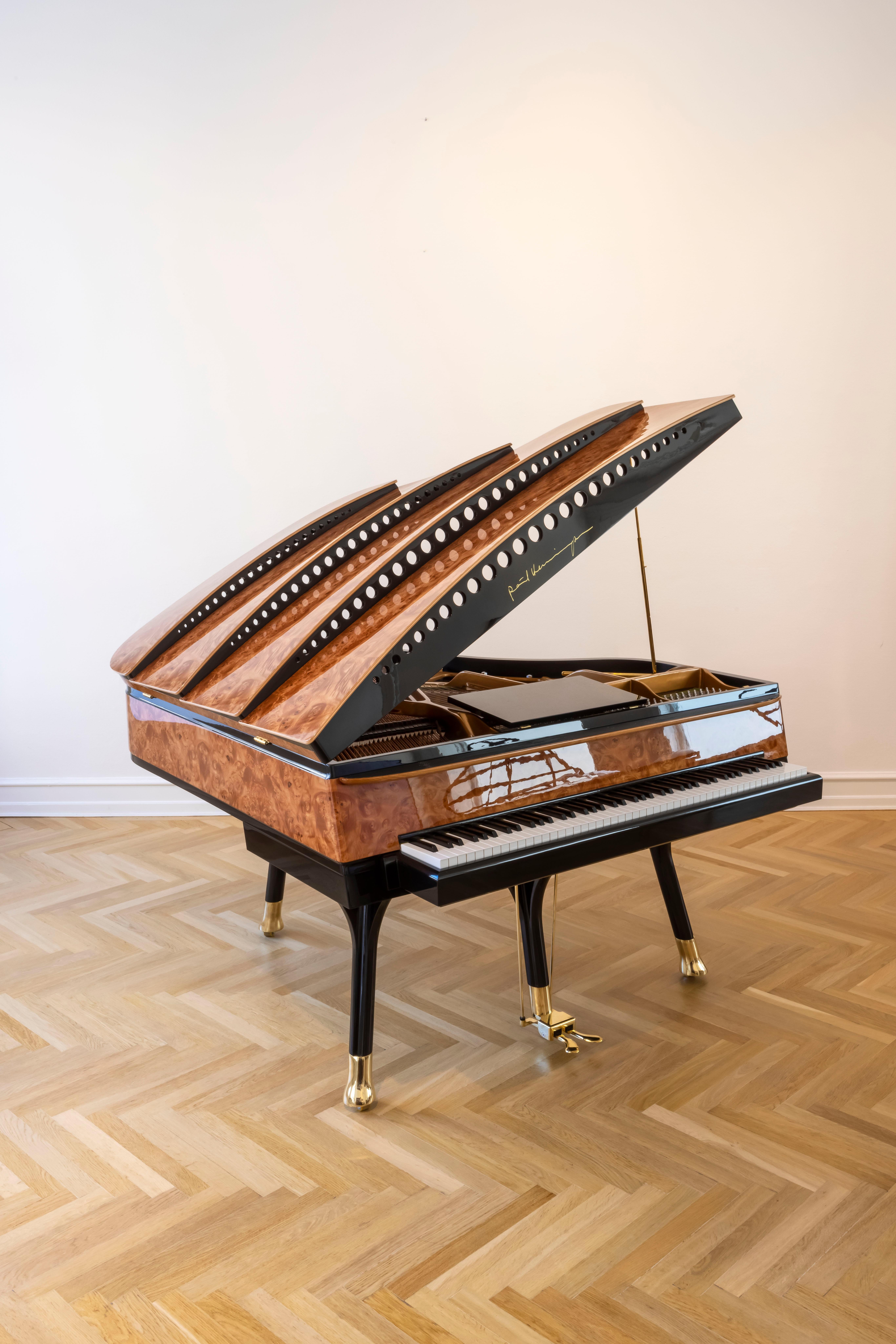 - All prices are listed ex works.
- 5 year guarantee.
- We regularly crate, ship and install PH Pianos worldwide with full insurance.

This gorgeous new PH Bow Grand Piano, finished in American Red Maple Burl, is an incredible instrument first