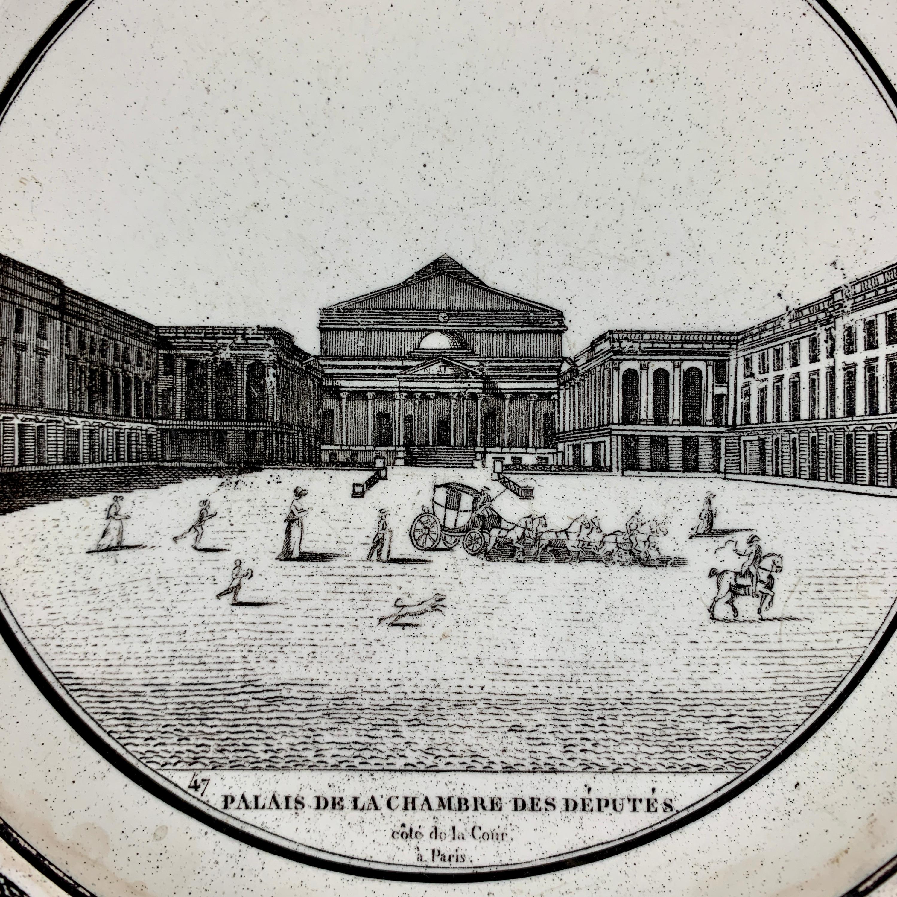 A French neoclassical faïence transfer printed creamware plate, circa 1820-1830.

A black transfer of an architectural image on a creamware body, depicting the Palais de la Chambre des Deputés à Paris. The building is prominent, with figures in