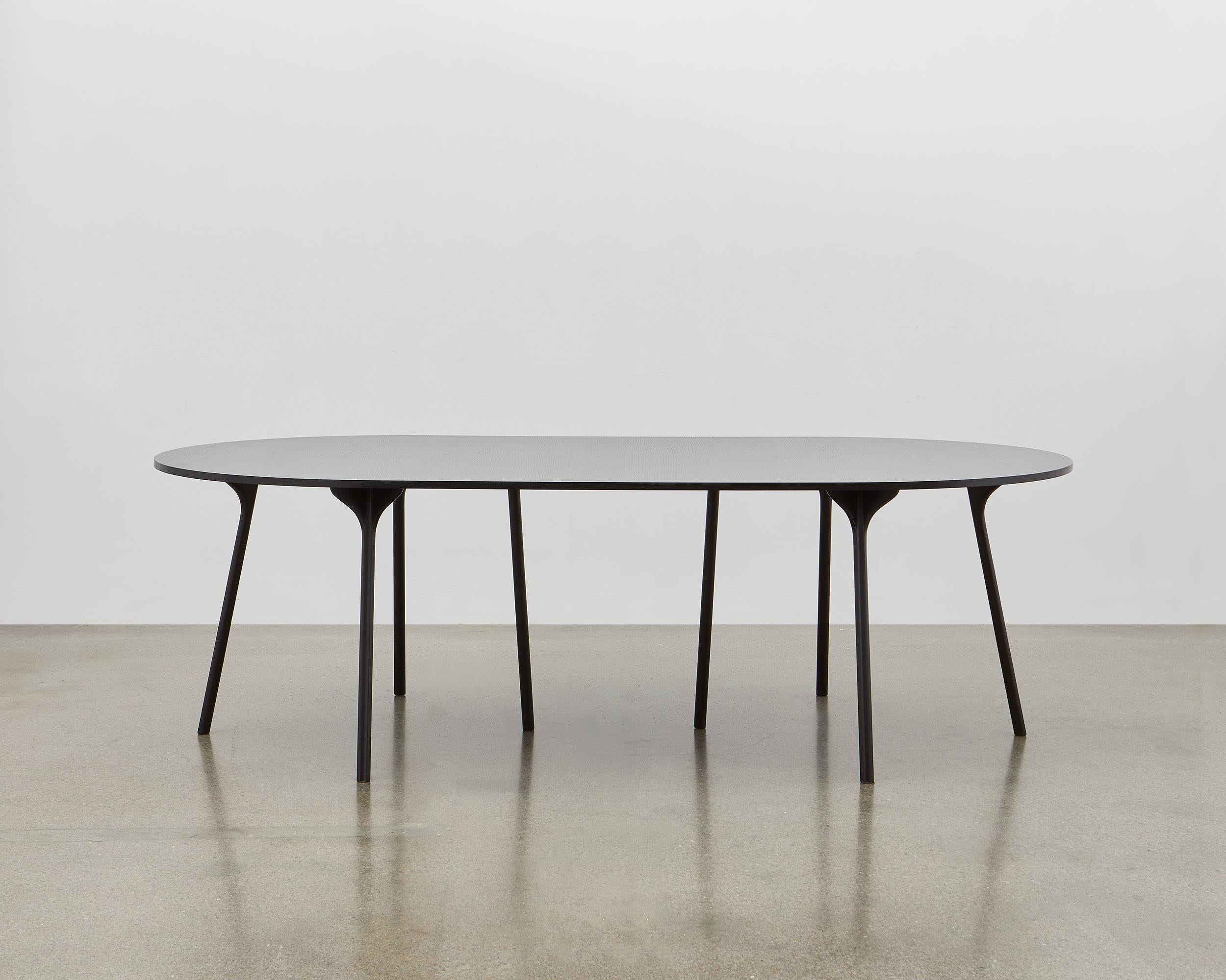 The intricately shaped legs of the PH Circle Table – inspired by the agile movement of the scarab beetle, together with the benefit of precision design and engineering – enable Poul Henningsen to design a table with the most unobtrusive of legs.