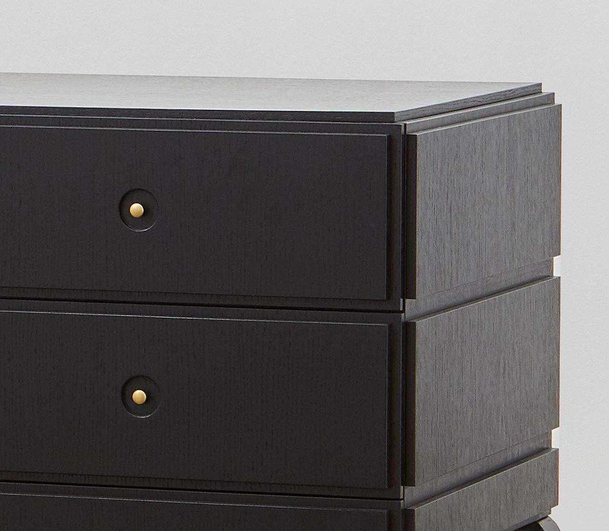 black dresser with gold legs