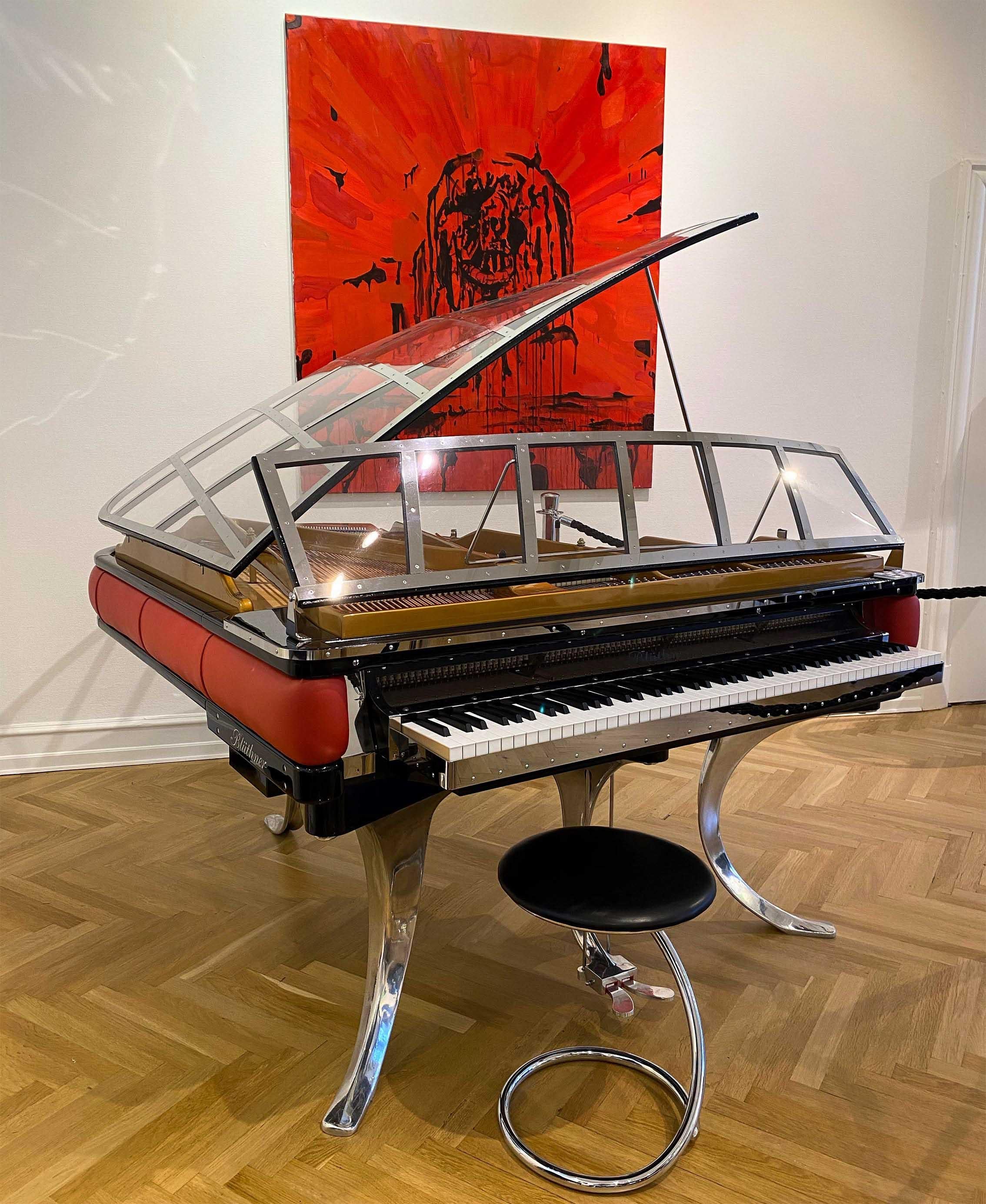 - All prices are listed ex works.
- 5 year guarantee.
- We regularly crate, ship and install PH Pianos worldwide with full insurance.

This PH Grand Piano is crafted in 2018 and is a total eye catching icon with the red leather rim and high