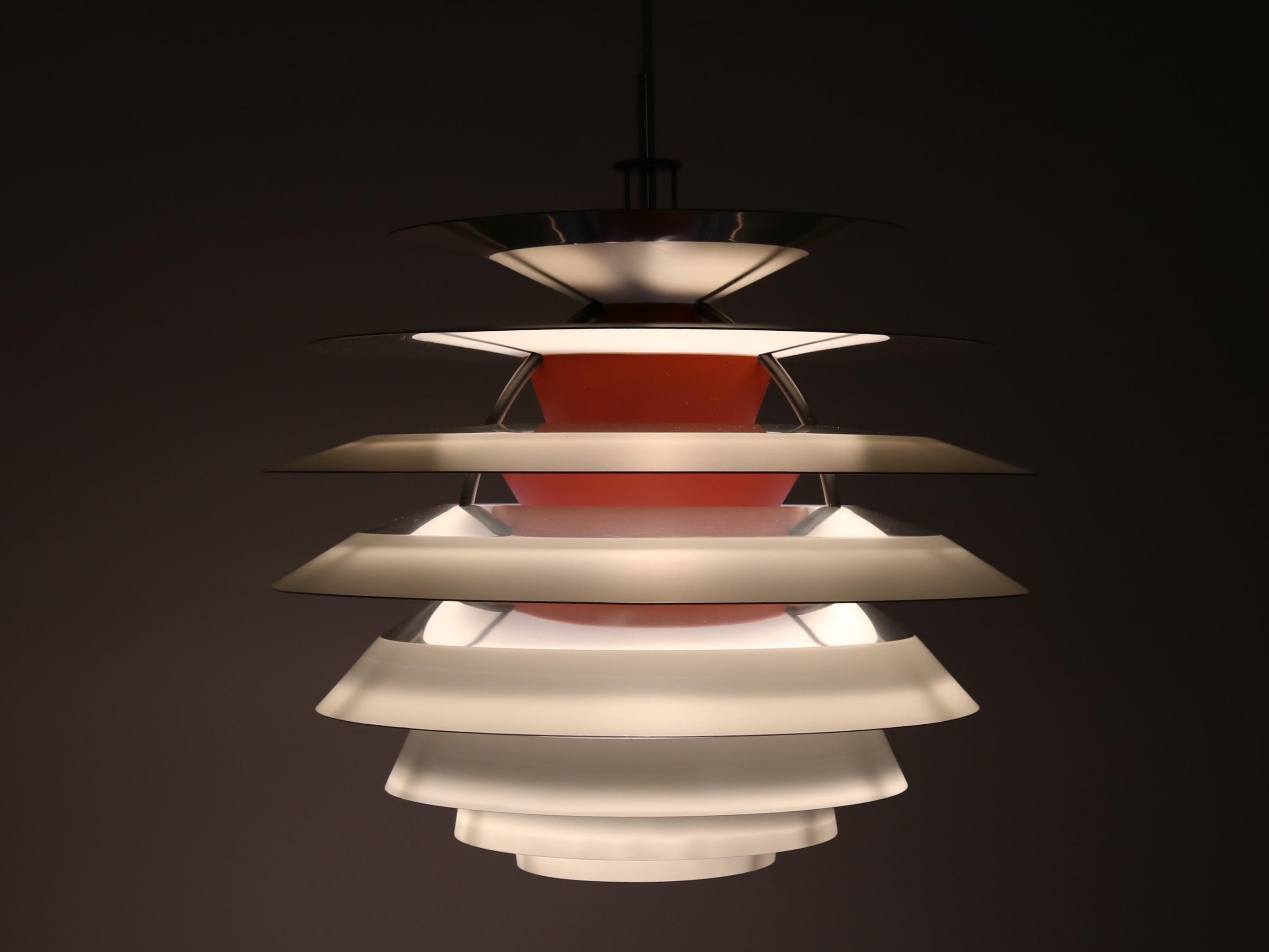 Iconic piece of design from Poul Henningsen. The PH Kontrast pendant lamp was designed by Poul Henningsen for Louis Poulsen, Denmark, 1958-1962. Poul Henningsens masterpiece, the PH Kontrast consists of ten shades. Each shade has four different
