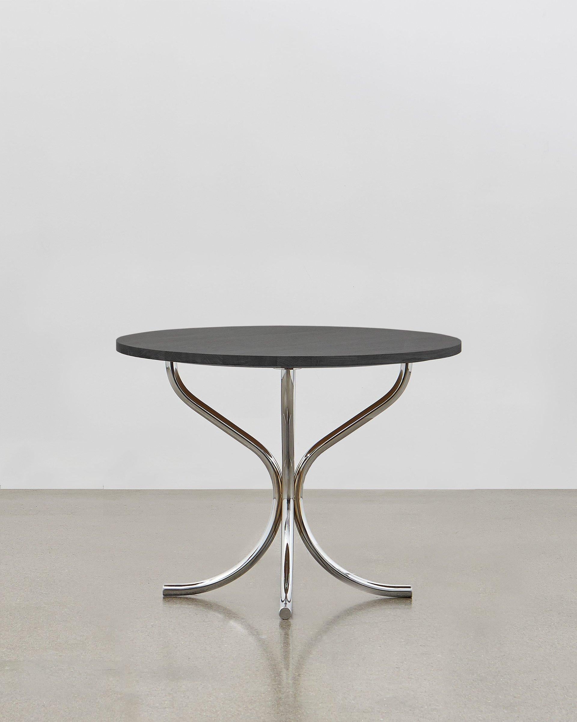 The PH lounge table designed by Poul Henningsen is the perfect addition to any lounge space where a table is required to gather around or for display. Taller than a low coffee table, the PH lounge table lends itself to a wide variety of settings,