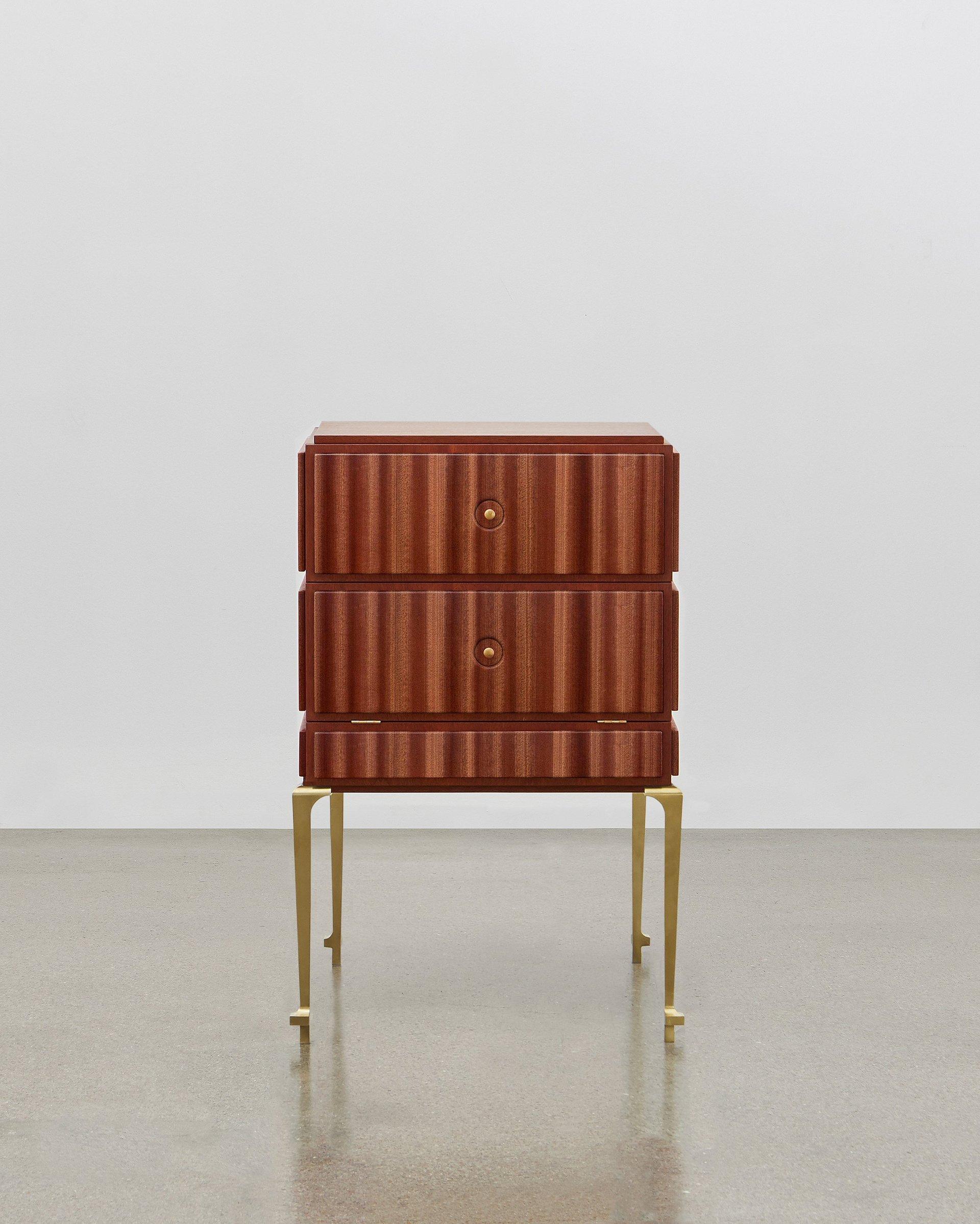 This small but perfectly formed storage piece is made out of wood and can be combined with soft leather on the panels. 

It is elegant and stylish all the way around and from all angles. Poul Henningsen designed this in 1920.

The PH small