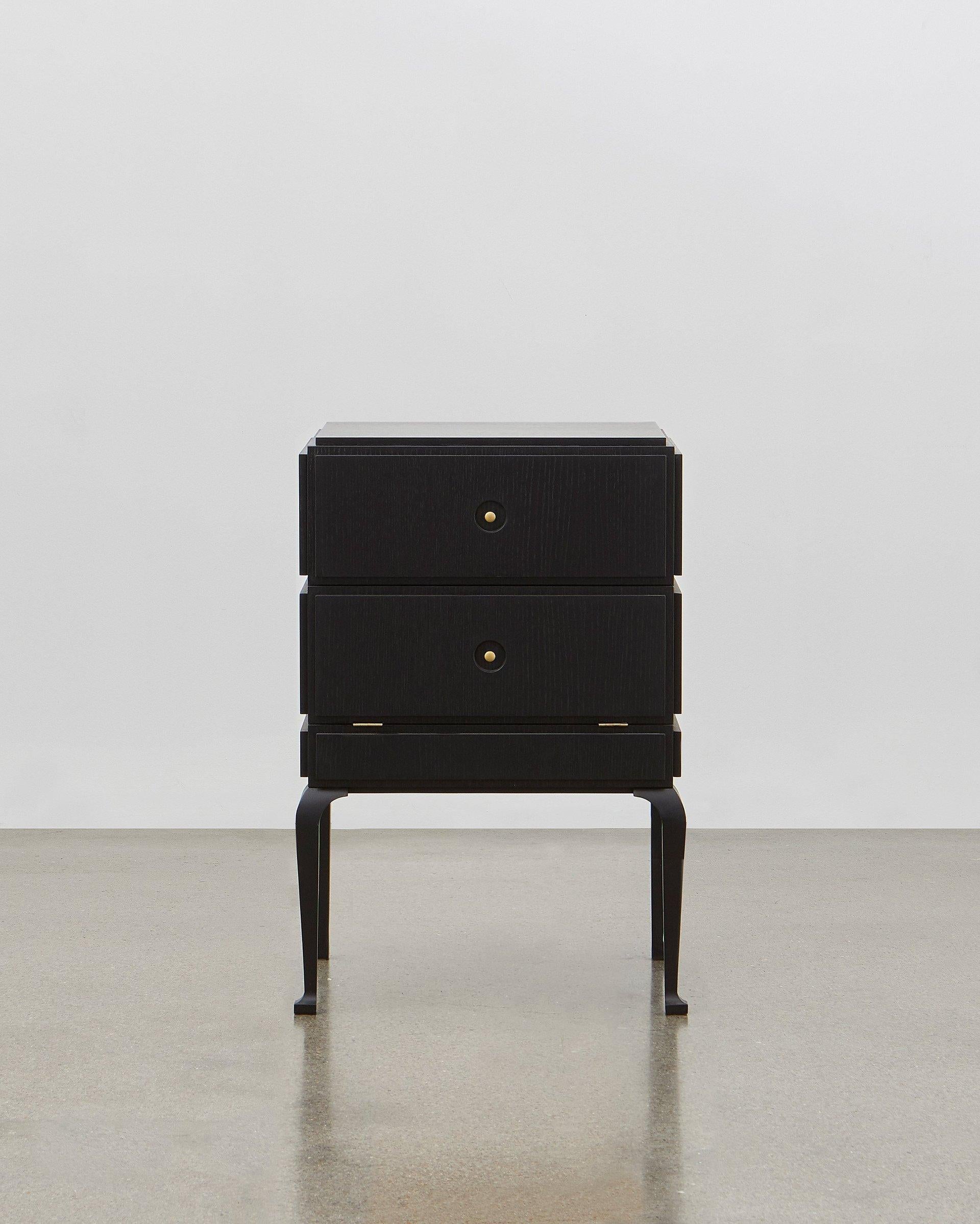 This small but perfectly formed storage piece is made out of wood and can be combined with soft leather on the panels. 

It is elegant and stylish all the way around and from all angles. Poul Henningsen designed this in 1920.

The PH small