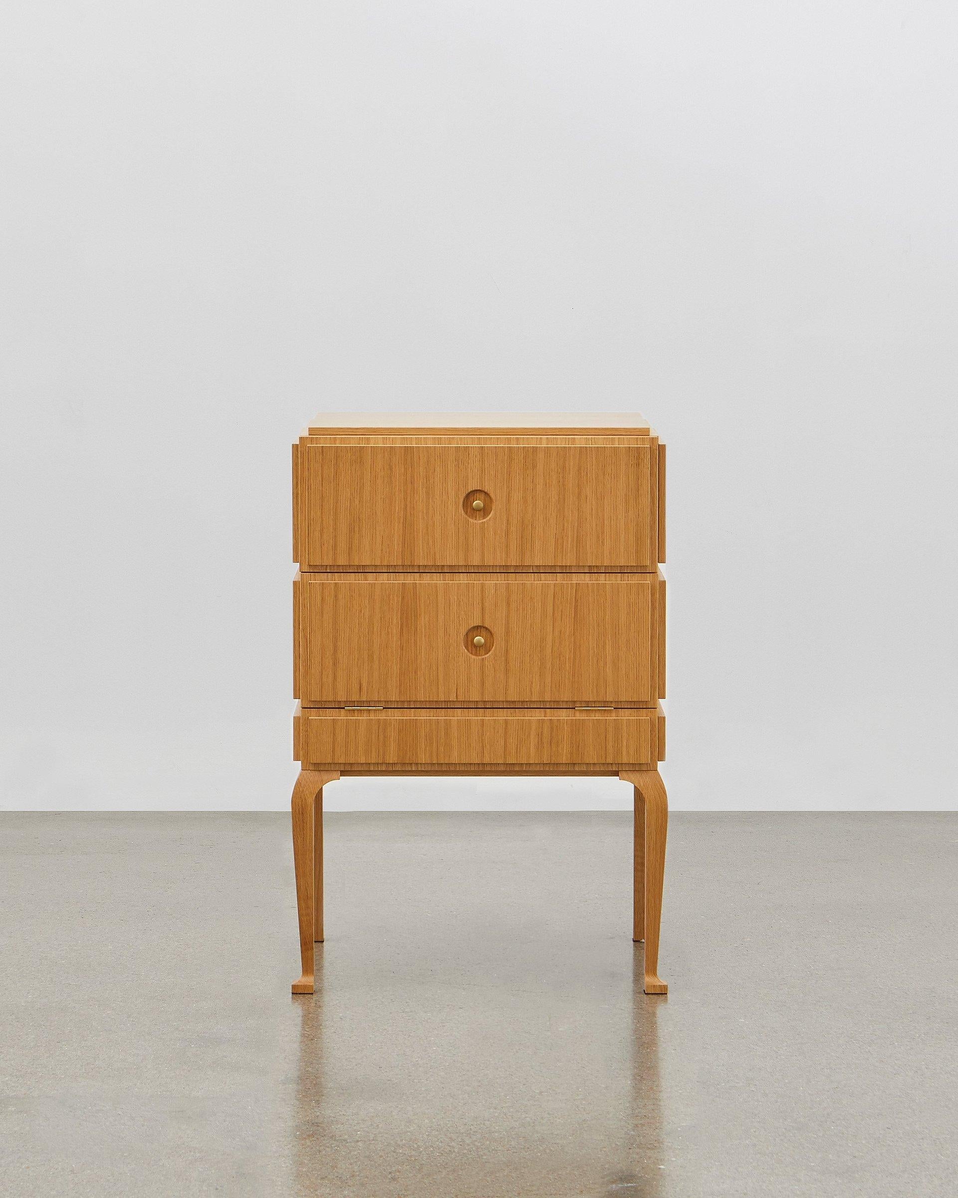 This small but perfectly formed storage piece is made out of wood and can be combined with soft leather on the panels. 

It is elegant and stylish all the way around and from all angles. Poul Henningsen designed this in 1920.

The PH Small