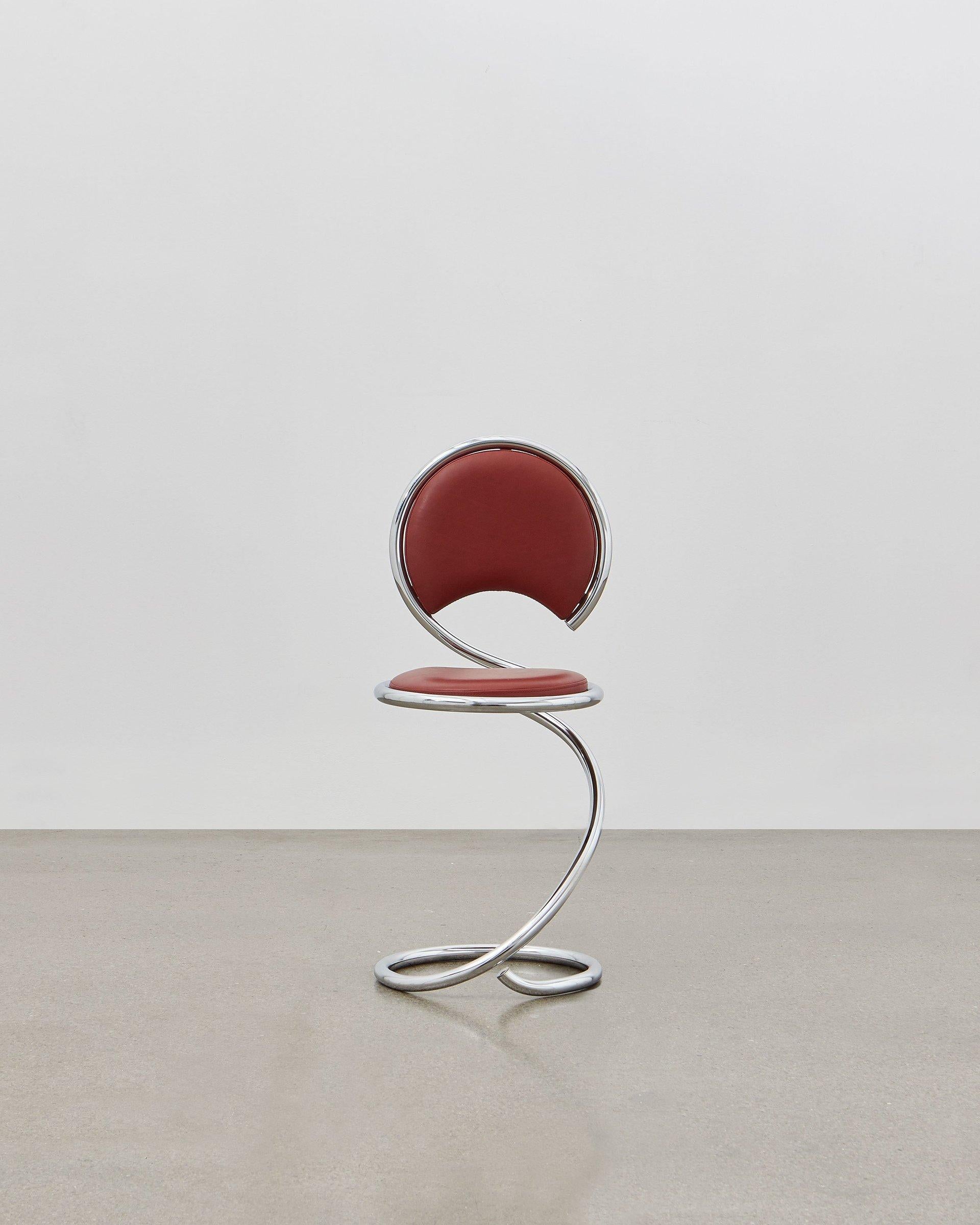 The PH snake chairs flowing lines within its steel tube design are inspired by the strong yet flexible body of a snake. It is multi-use and fits any room at home, in the apartment, in the office, with a function or simply as a piece of art to be