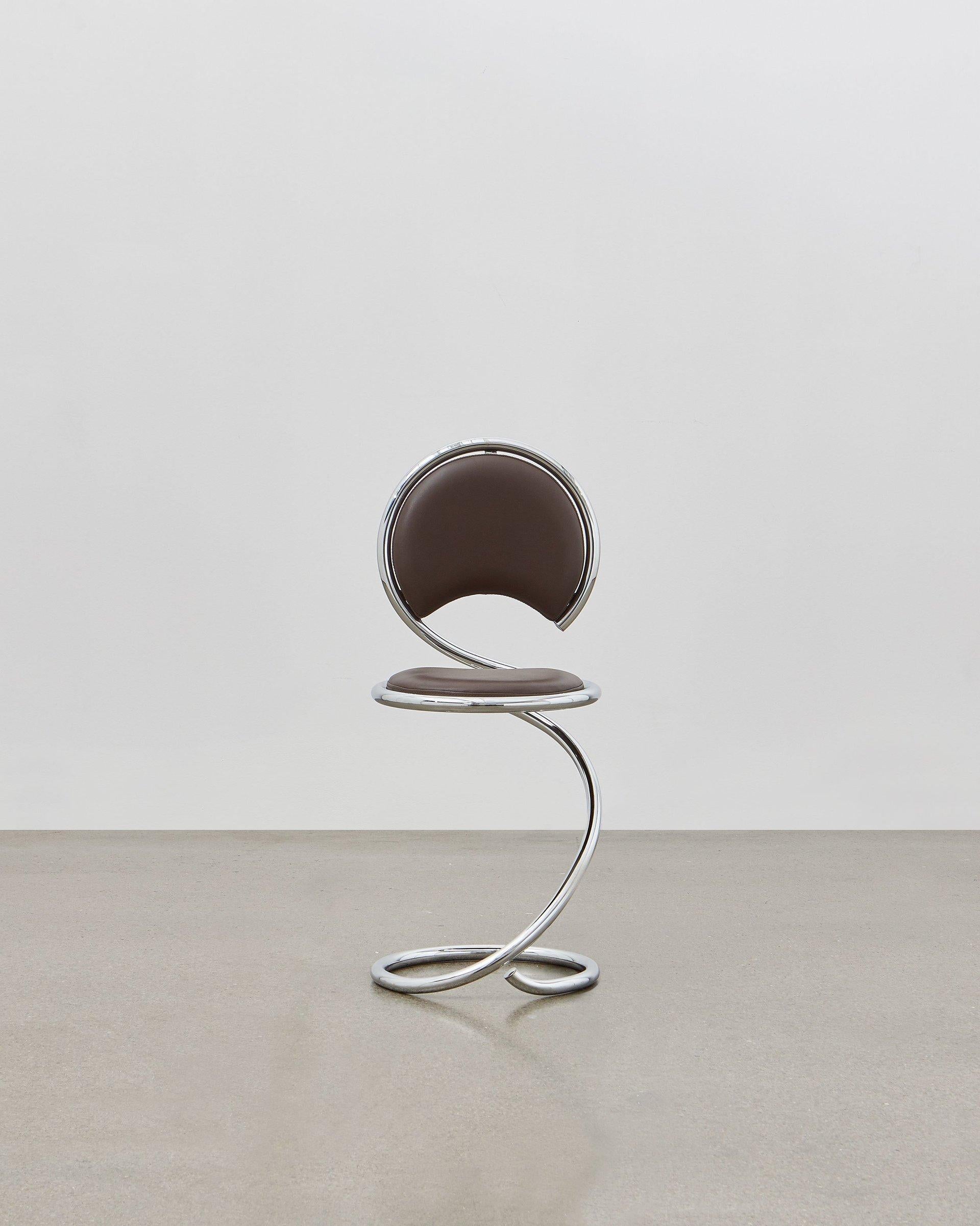 The PH snake chairs flowing lines within its steel tube design are inspired by the strong yet flexible body of a snake. It is multi-use and fits any room at home, in the apartment, in the office, with a function or simply as a piece of art to be