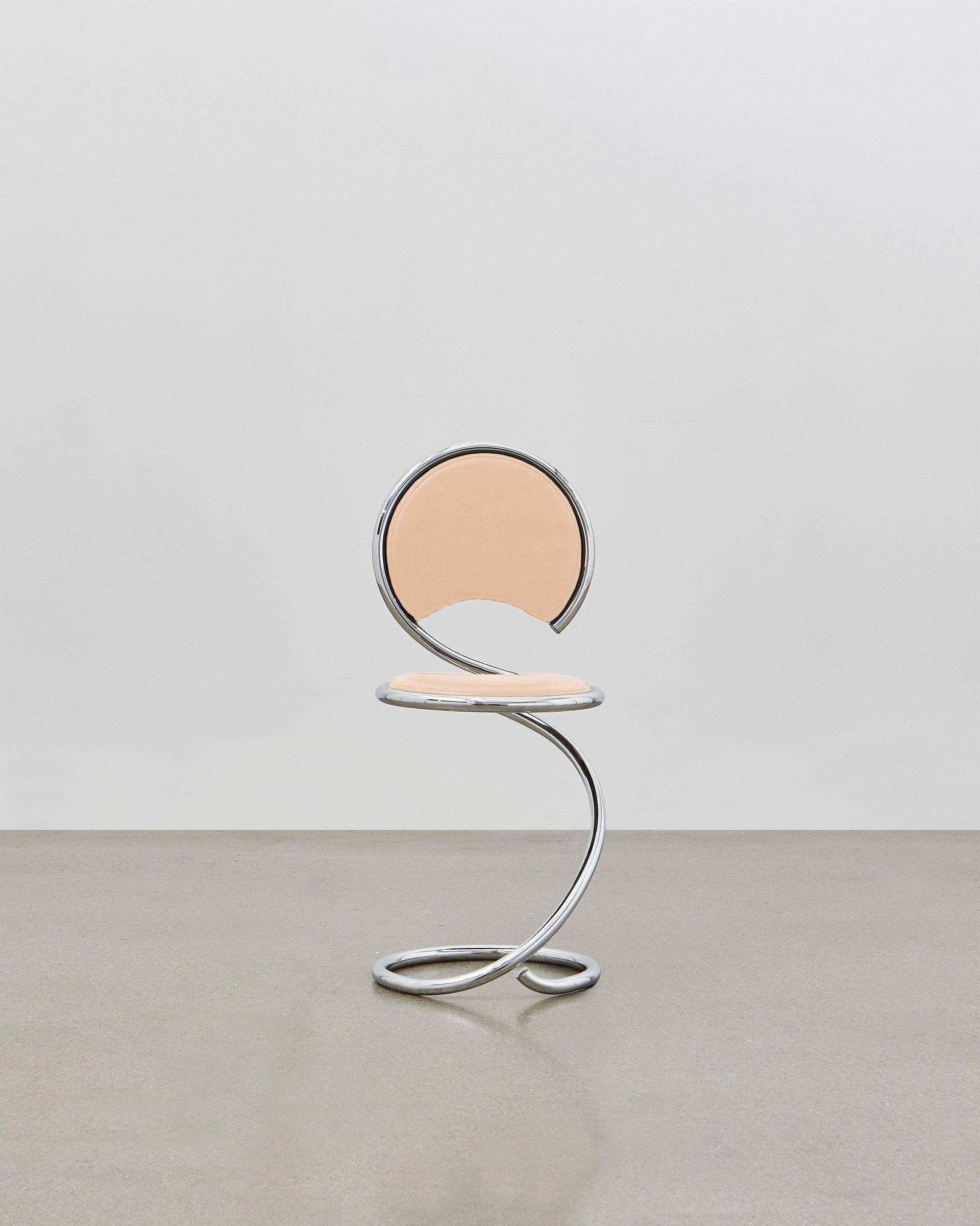 The PH Snake chairs flowing lines within its steel tube design are inspired by the strong yet flexible body of a snake. It is multi-use and fits any room at home, in the apartment, in the office, with a function or simply as a piece of art to be