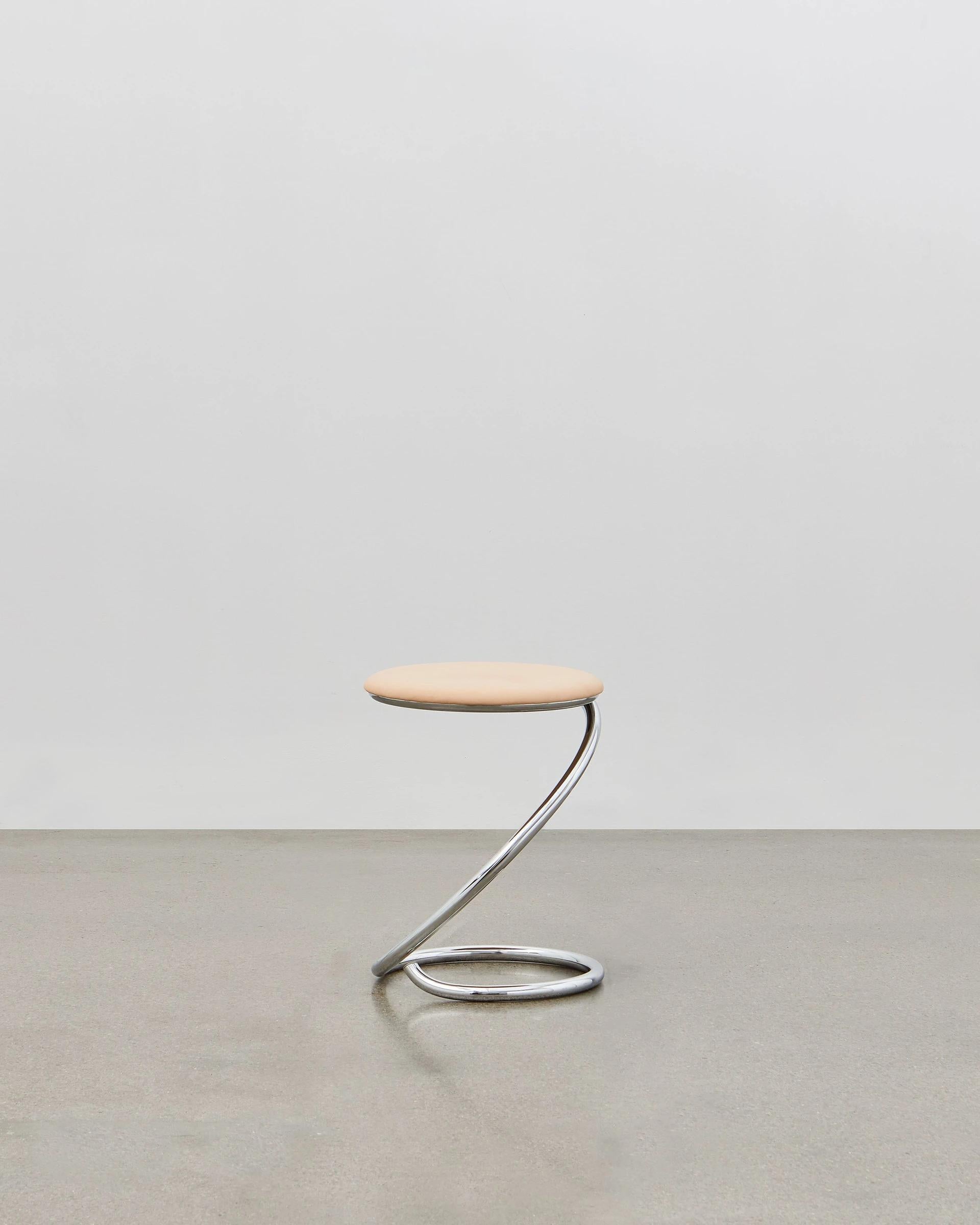 The PH snake stool is completely true to the original design and the use of chromed steel tubes, however updated for the 21st century to be available with wood seating in five colorways to coordinate with the ever-popular Poul Henningsen lighting