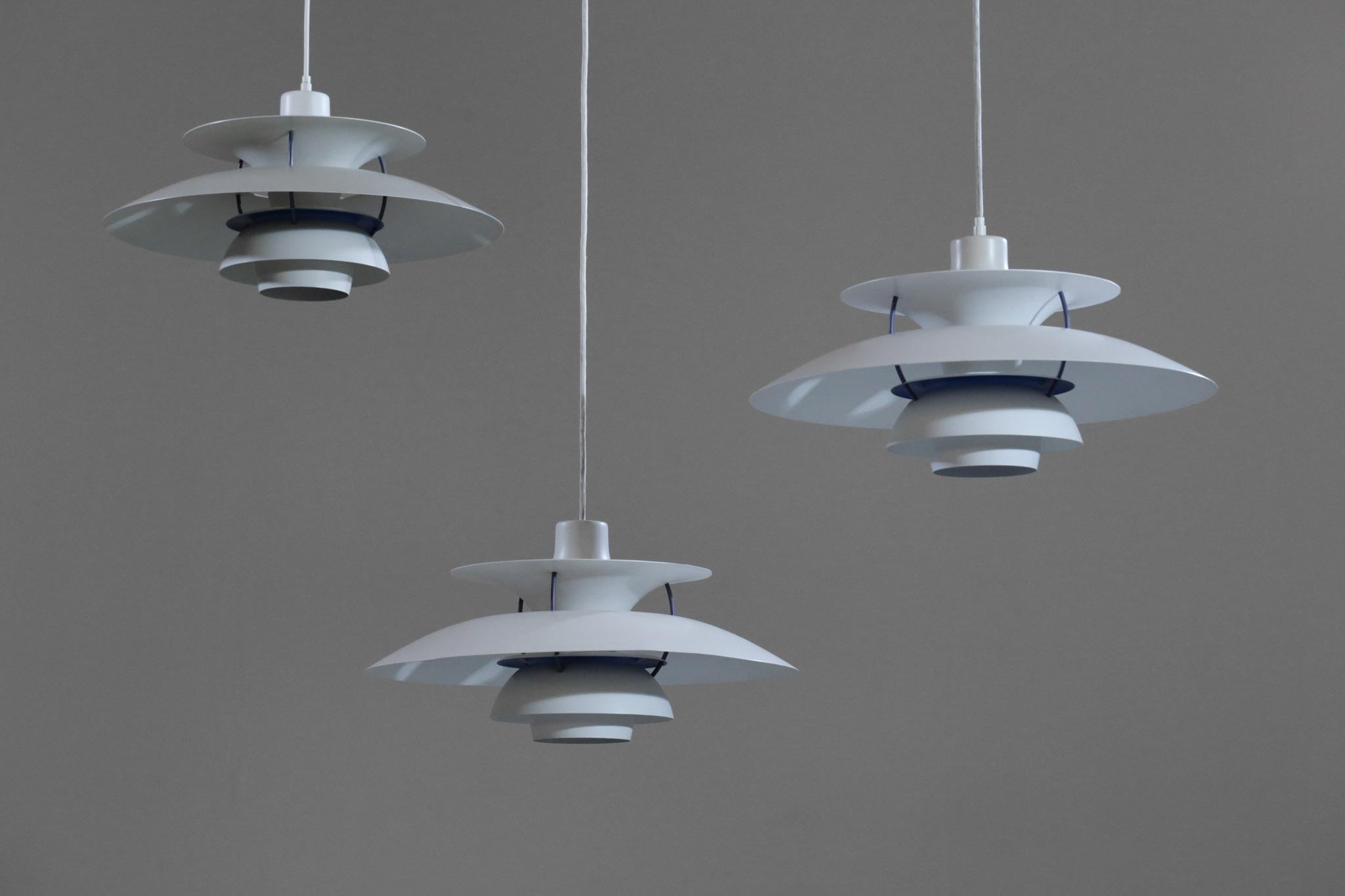 Set of 4 ceiling lamp by Poul Henningsen, model PH5, edited by Louis Poulsen. Structure in white with blue color inside.