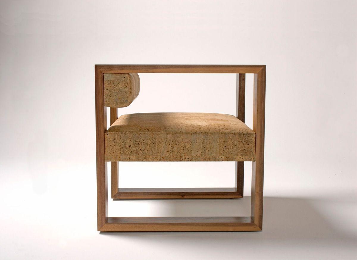 Fashioned with the geometry of a cube in mind, the square proportions of this chair are a self contained exercise in simplicity. The solid wood arms border the suspended back and seat rest and create a compact and functional seat. The name Bikini is