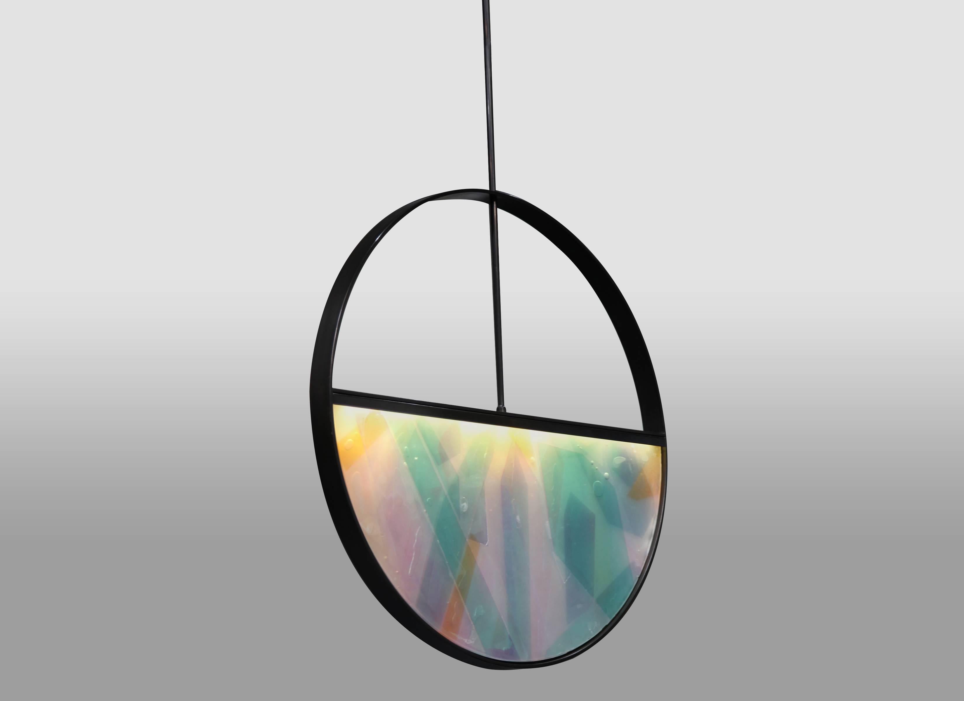 The Phase Pendant began with a collaborative investigation between Kin and Kim Markel — fellow Sight Unseen favorite — in which their native materials informed the iterative design process. They found beauty in layering acrylic, resin, and steel,
