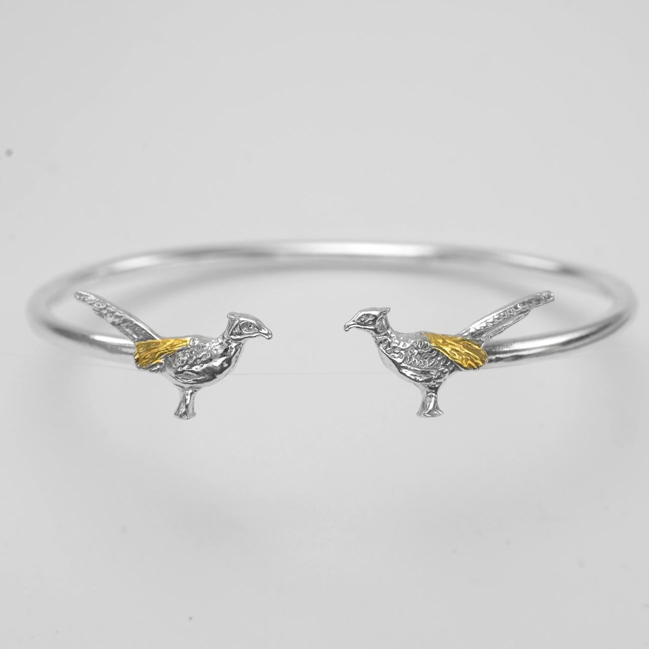 Contemporary Pheasant Bangle in Sterling Silver and 18 Carat Gold For Sale