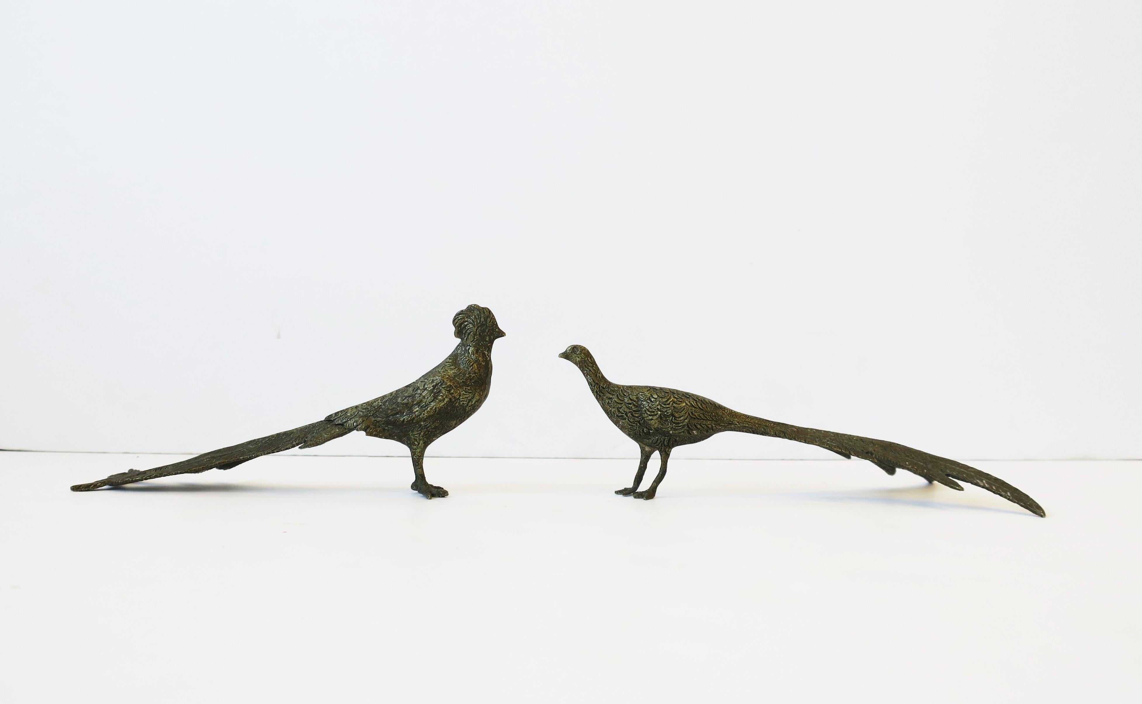 A small pair of brass peacock or pheasant bird decorative objects with textured surface, circa late-20th century. A great set for a bookshelf, fireplace mantle, dining table, etc. 

Measurements: 
.63