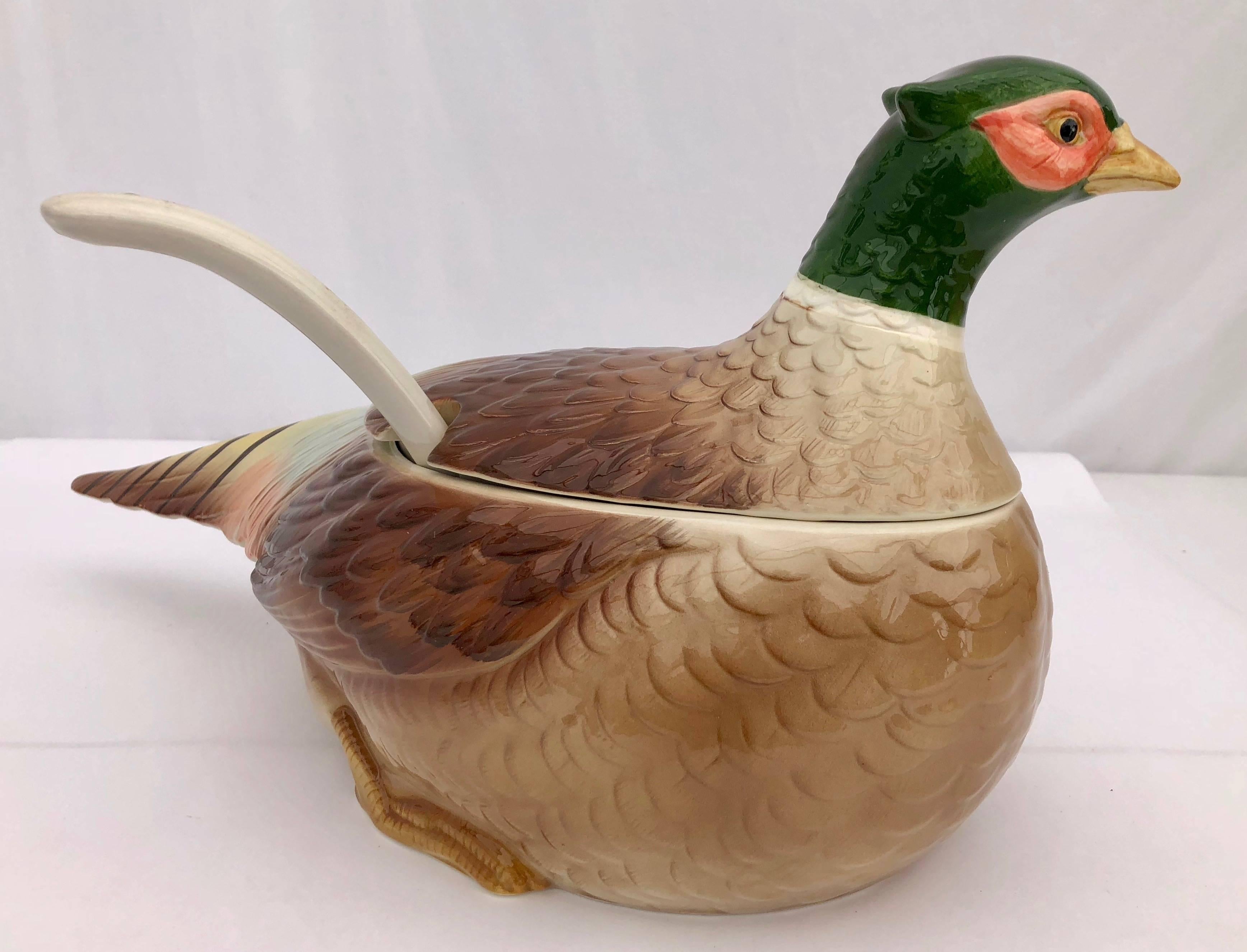 This is a handcrafted ceramic pheasant soup tureen with its ceramic serving spoon, by Otagiri, Japan. It was purchased for a French restaurant, but never used. It comes in its original box. The hand painted colors are vibrant. This would add a