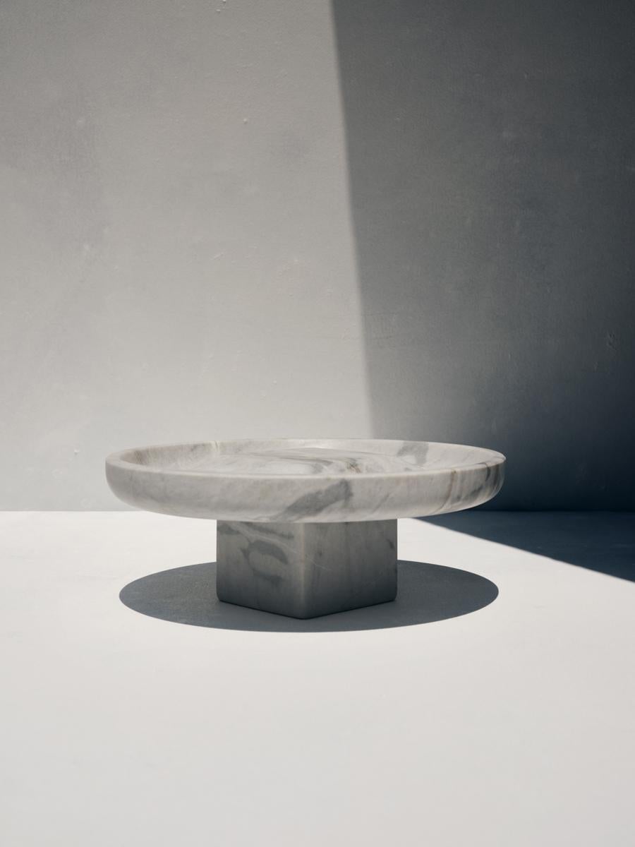 Phebe tray by Faye Tsakalides. 
Dimensions: 23 W x 23 L x 9 H cm
Materials: Lais grey marble. 
Technique: Crafted from a single piece of marble. Hand-crafted, Polished. Mat finished. 

Faye Tsakalides is a Greek architect and designer based in