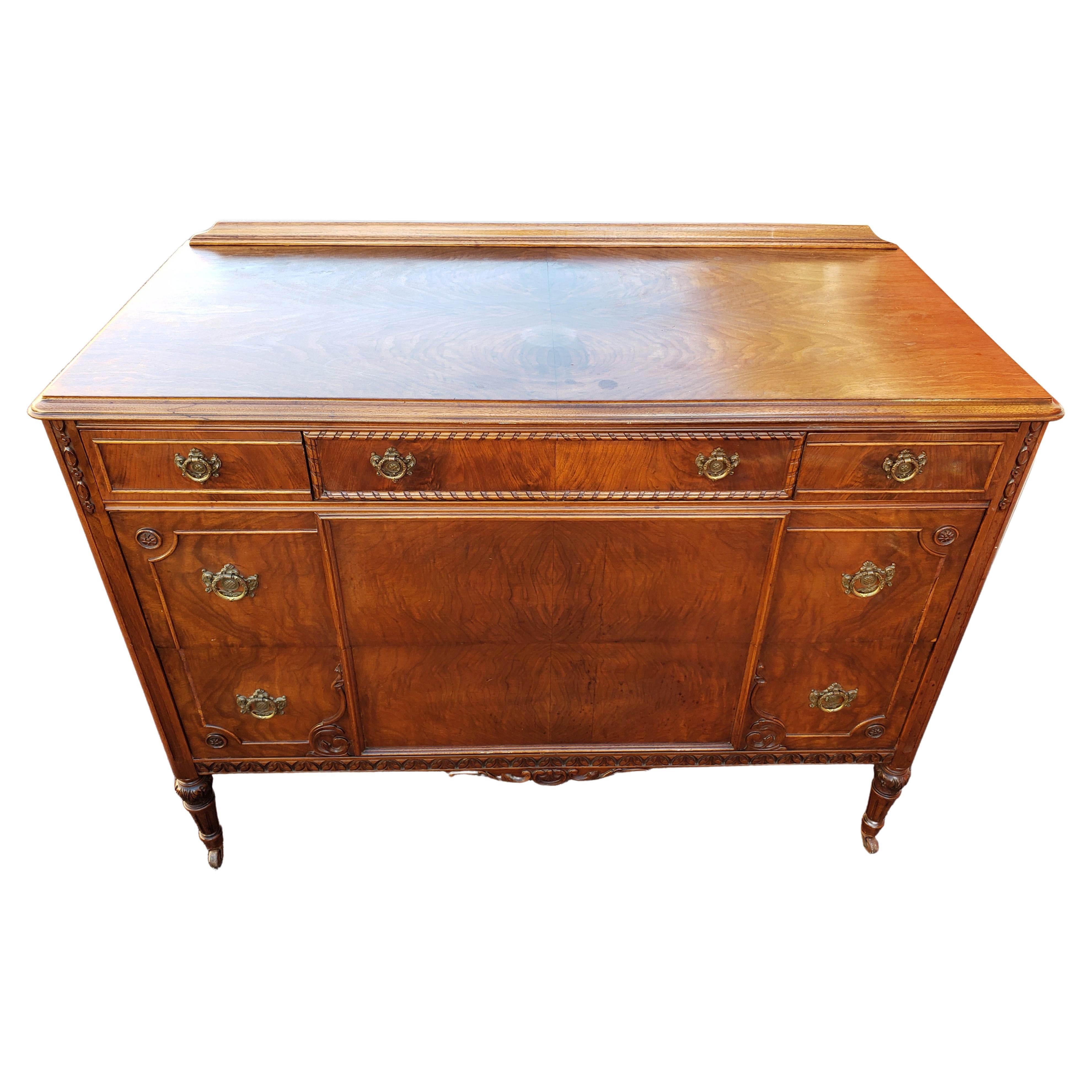 Beautiful, well crafted Dresser from the very reputable Phenix Furniture Co, Warren Pa. Very well made. Quality construction with dovetail finish & wood divided drawers.
This is an antique renaissance style French dresser. The piece is on wheels for