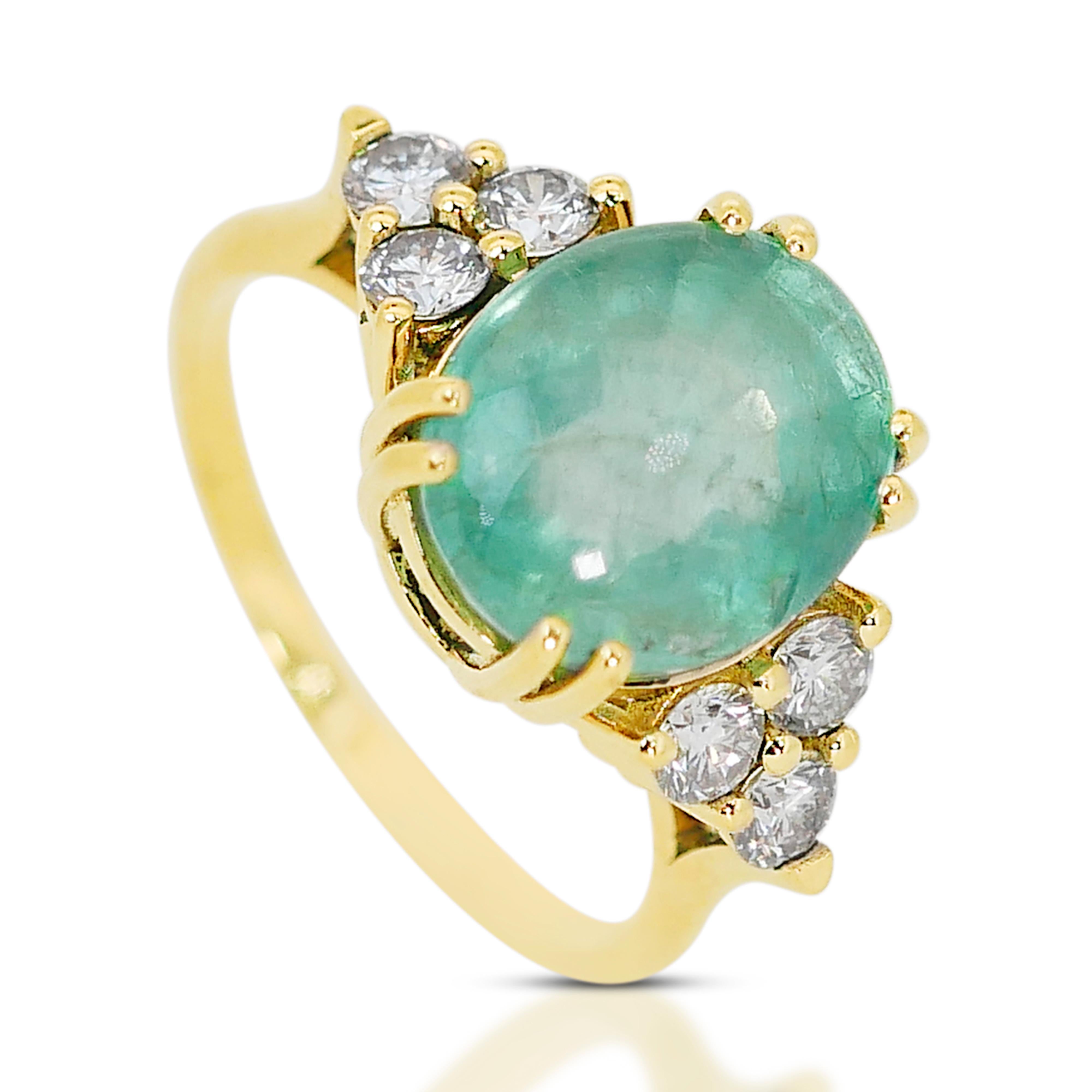 This captivating emerald ring is accompanied by an IGI Certification for authenticity and assurance. The emerald, cut into a captivating shape, is embraced by a halo of dazzling diamonds, creating a stunning contrast and enhancing the overall